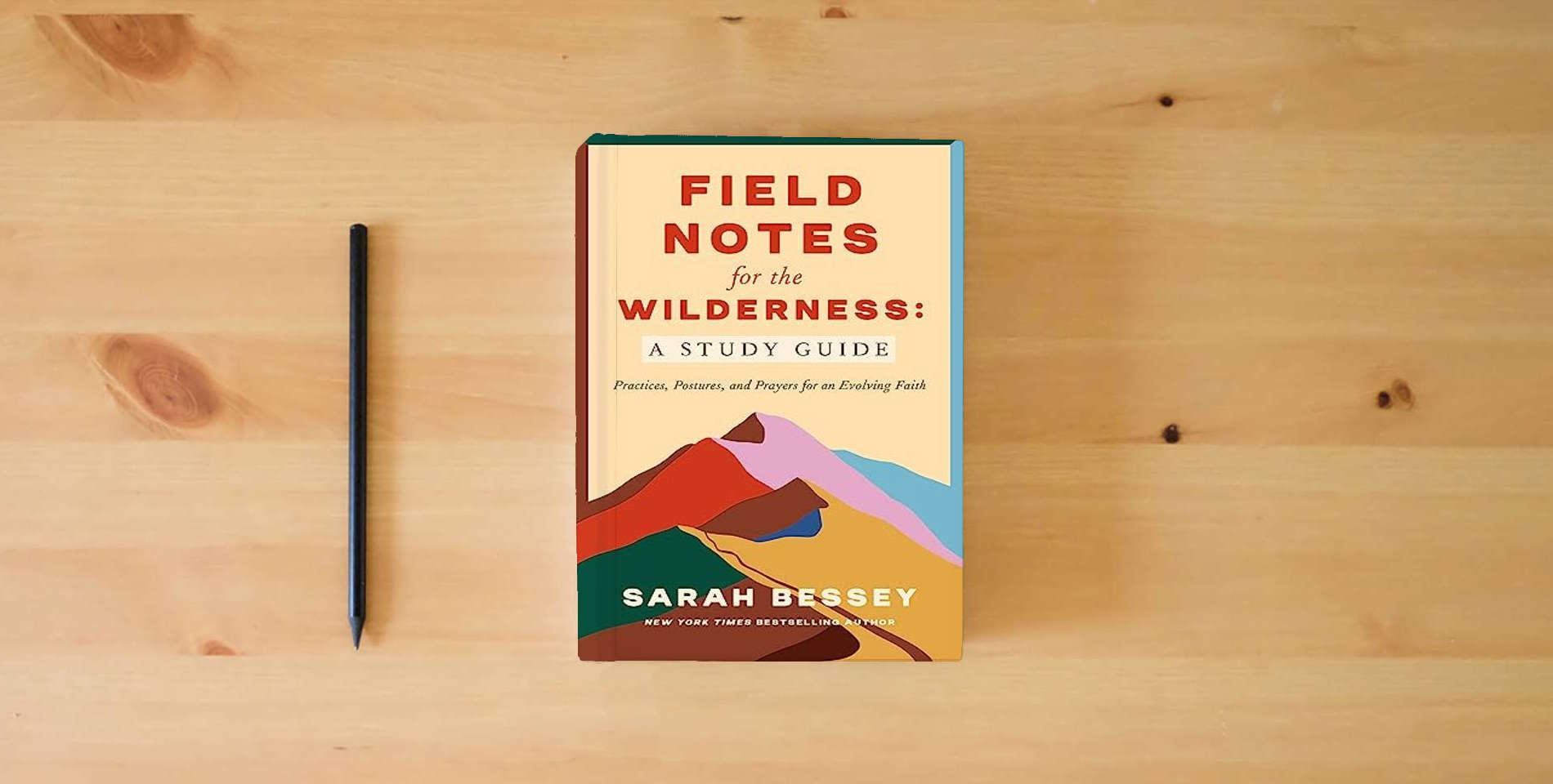 The book Field Notes for the Wilderness: A Study Guide: Practices, Postures, and Prayers for an Evolving Faith is on the table