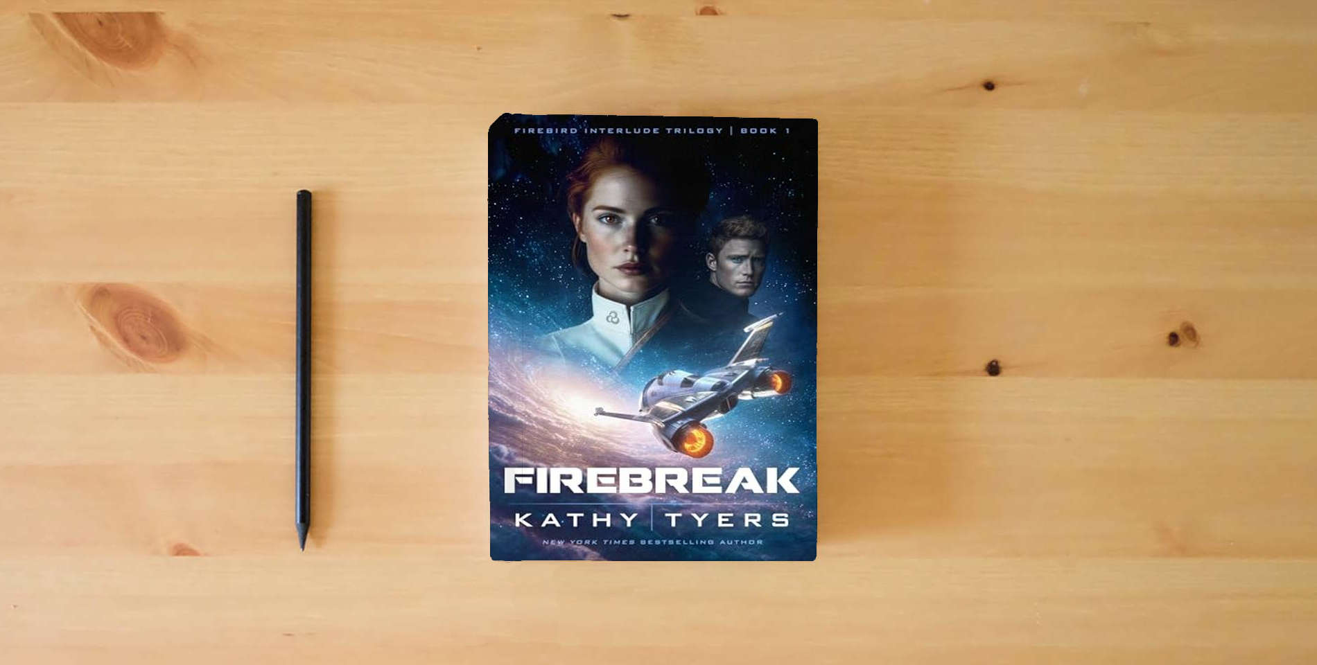 The book Firebreak (Volume 1) (Firebird Interlude Trilogy) is on the table