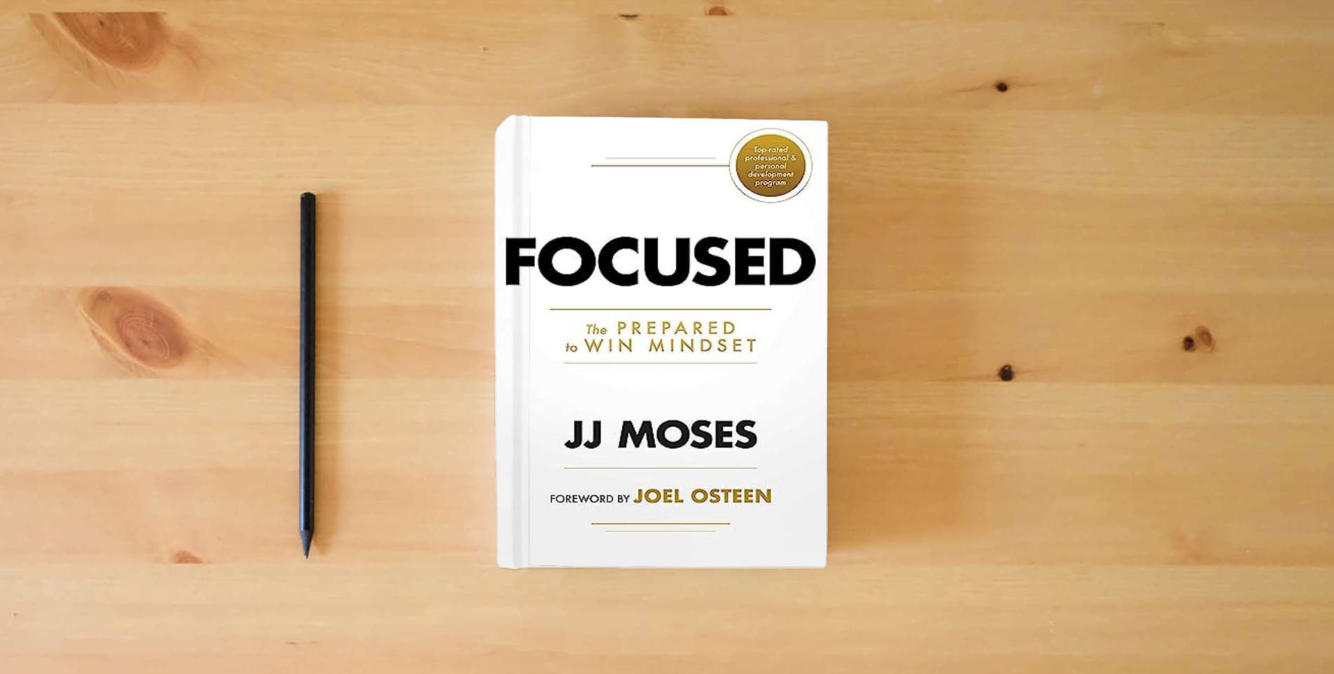 The book Focused: The Prepared to Win Mindset is on the table