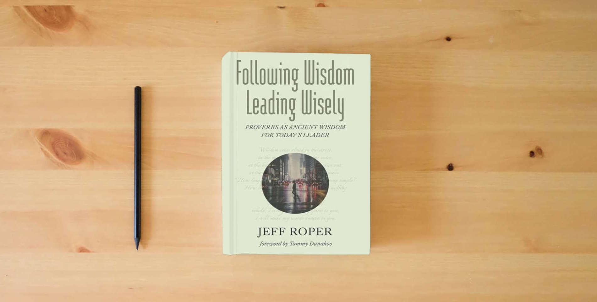 The book Following Wisdom, Leading Wisely: Proverbs as Ancient Wisdom for Today's Leader is on the table