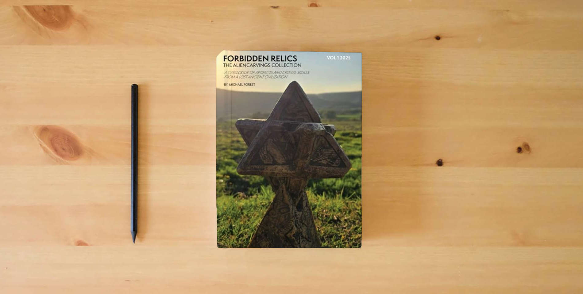 The book Forbidden Relics - Aliencarvings Collection Volume 1 is on the table