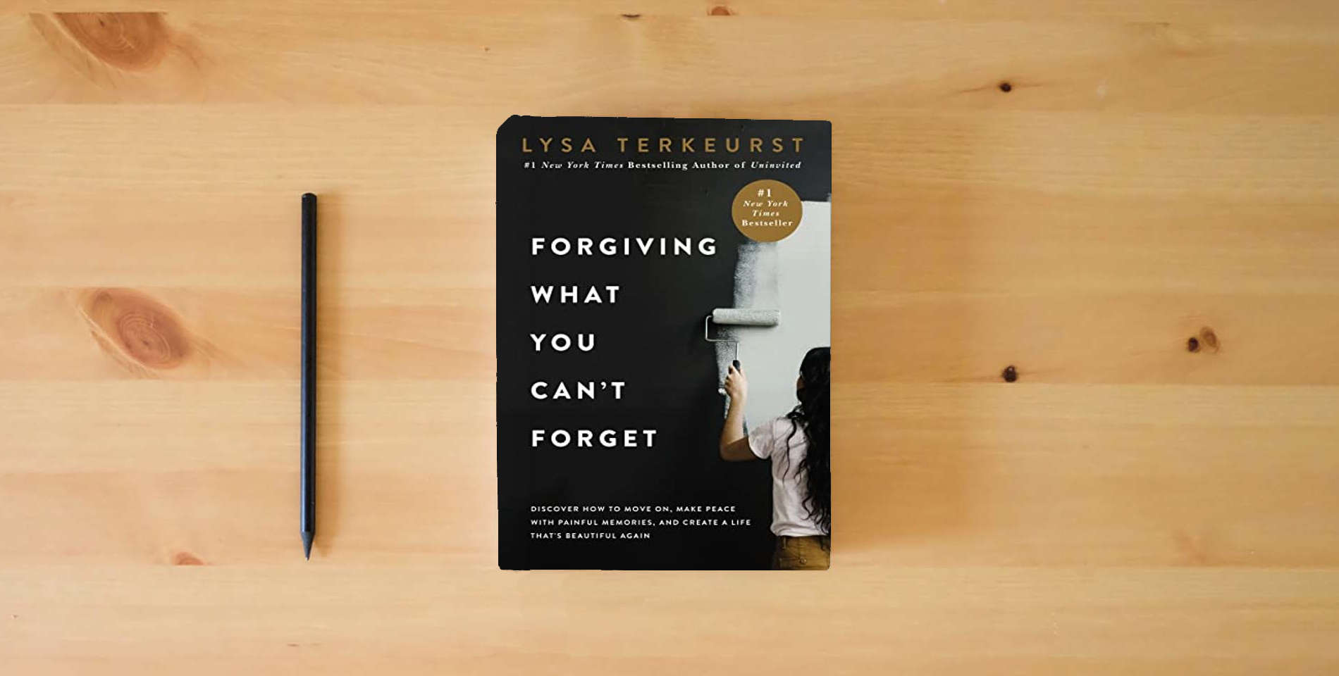 The book Forgiving What You Can't Forget: Discover How to Move On, Make Peace with Painful Memories, and Create a Life That’s Beautiful Again is on the table