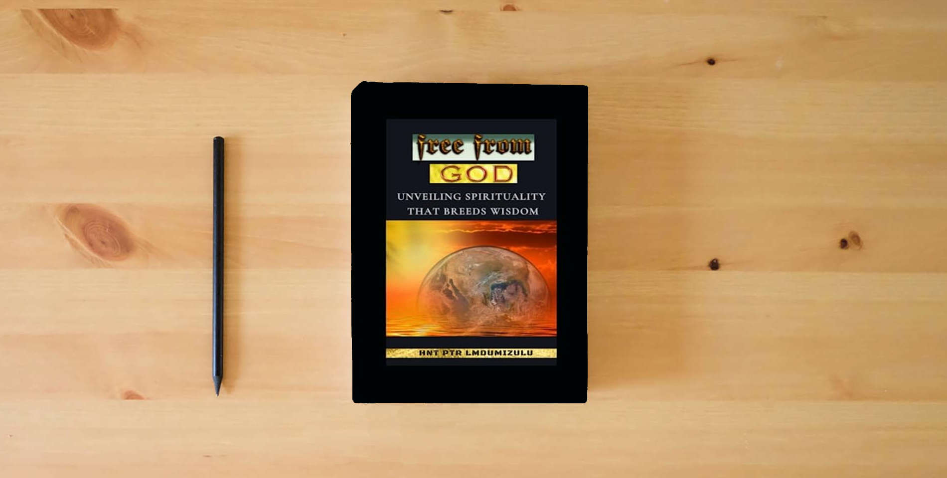 The book free from GOD: Unveiling Spirituality That Breeds Wisdom is on the table