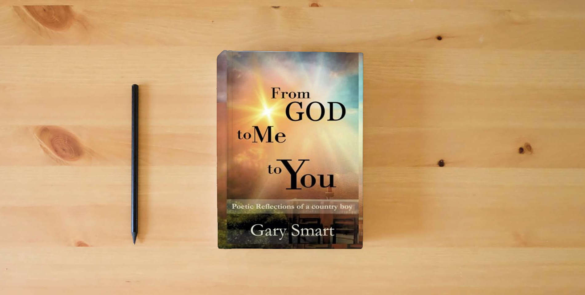 The book From God to Me to You: Poetic Reflections of a Country Boy is on the table