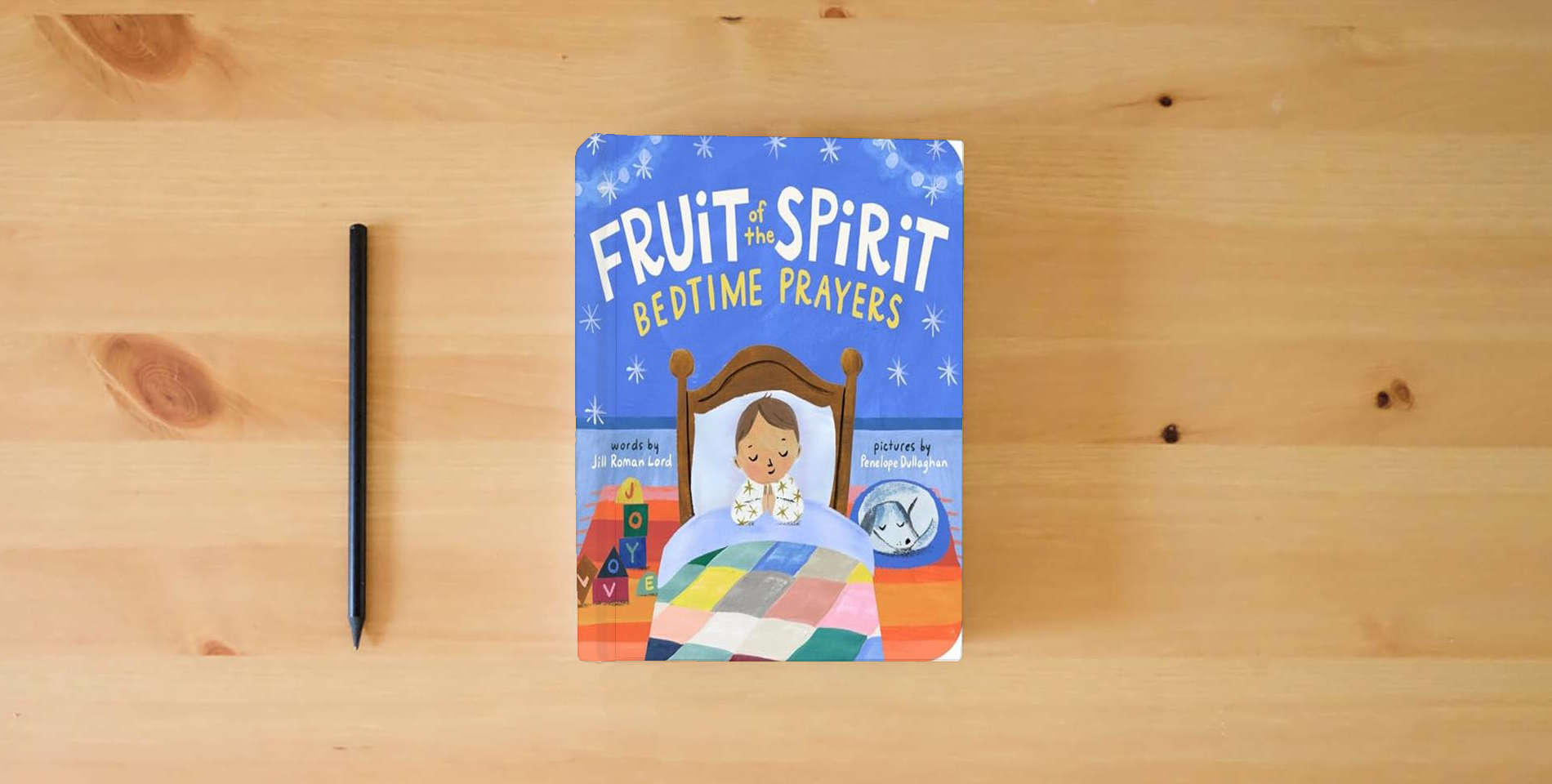 The book Fruit of the Spirit Bedtime Prayers is on the table