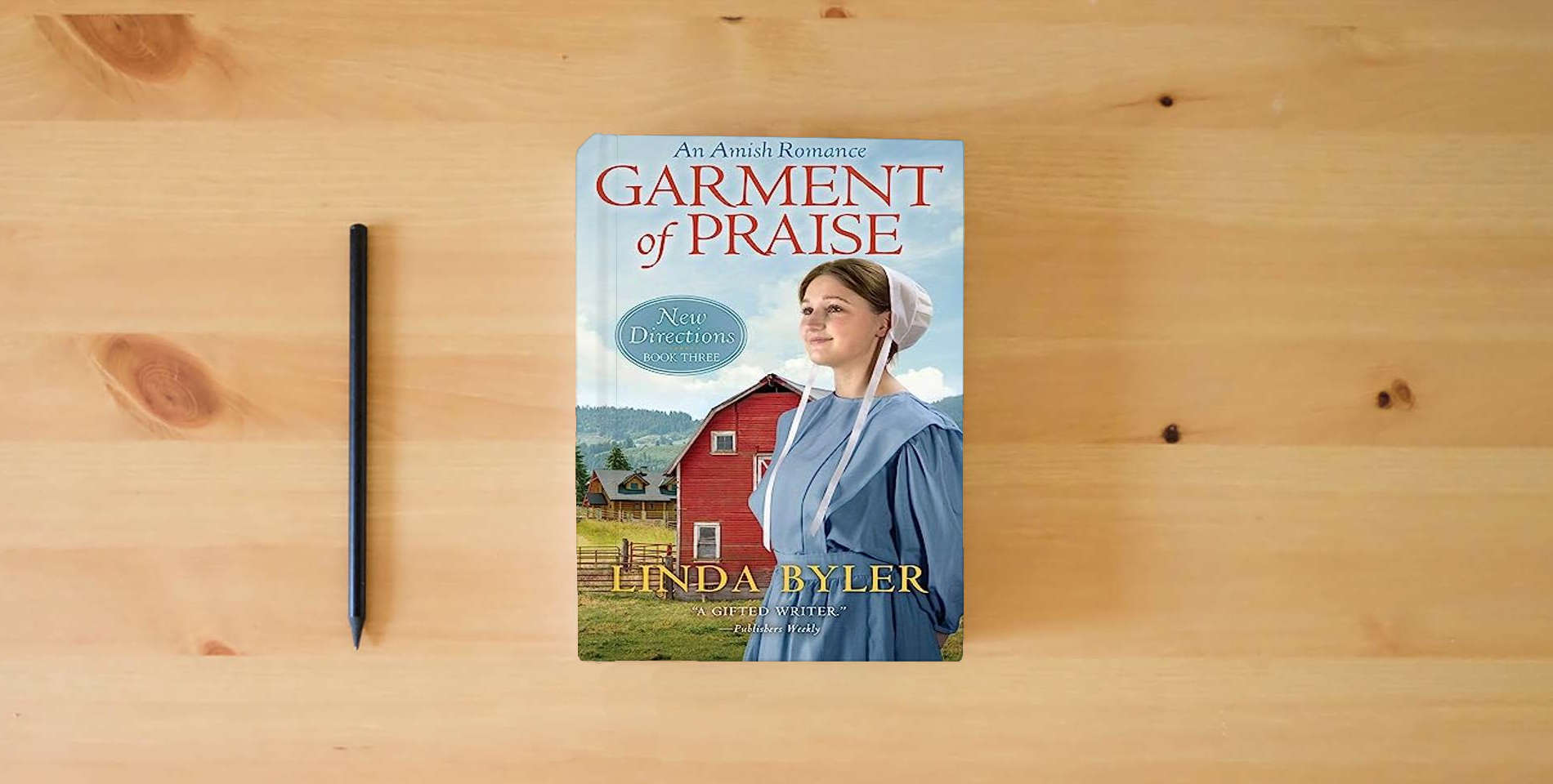 The book Garment of Praise: New Directions Book Three is on the table