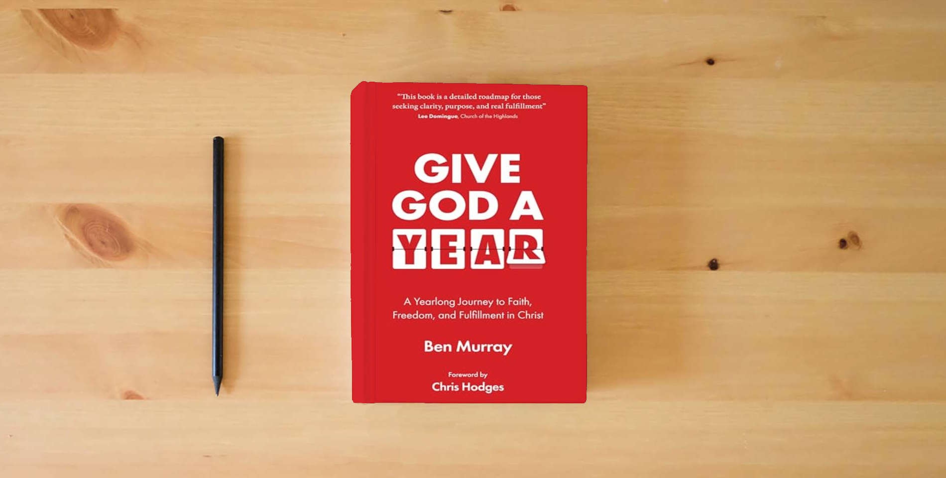 The book Give God A Year: A Yearlong Journey to Faith, Freedom, and Fulfillment in Christ is on the table