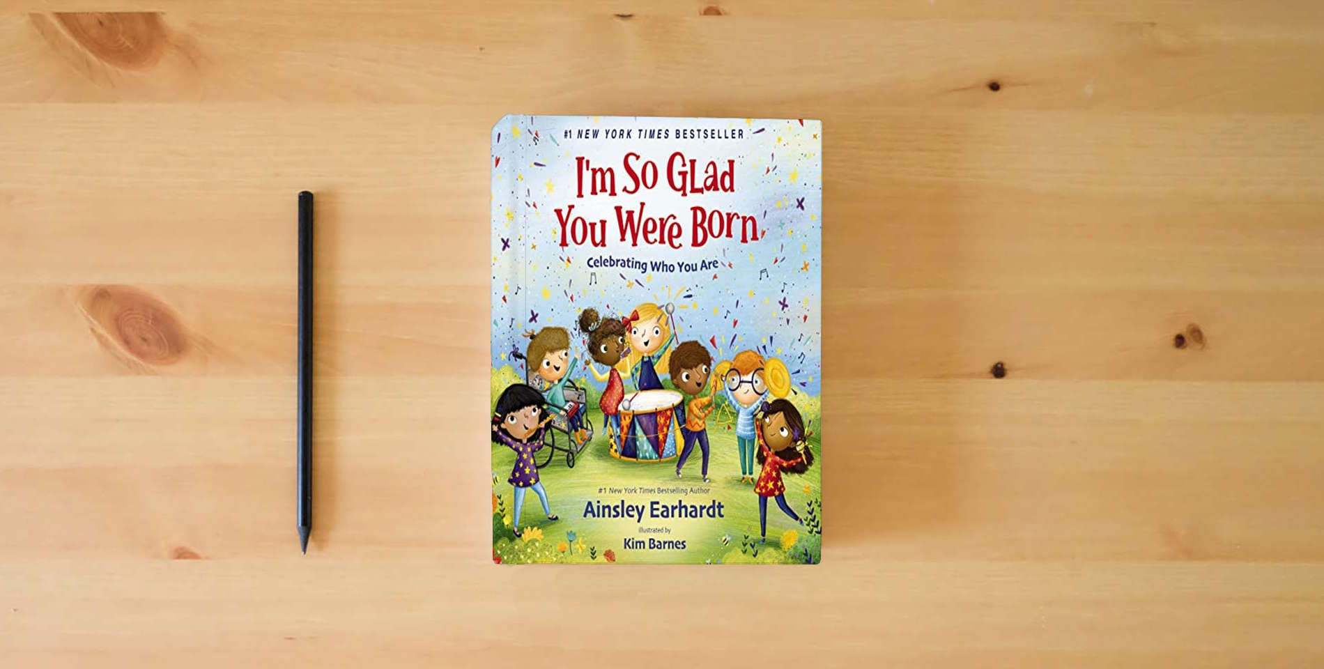 The book I'm So Glad You Were Born: Celebrating Who You Are is on the table