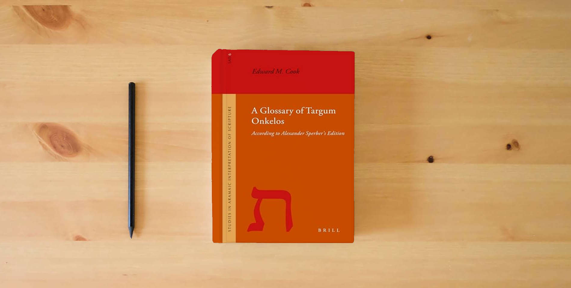 The book A Glossary of Targum Onkelos: According to Alexander Sperber's Edition (Studies in the Aramaic Interpretation of Scripture, 6) is on the table