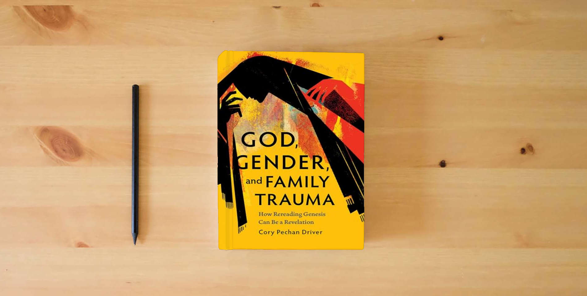 The book God, Gender, and Family Trauma: How Rereading Genesis Can Be a Revelation is on the table