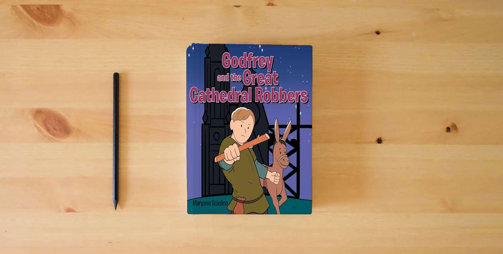 The book Godfrey and the Great Cathedral Robbers is on the table