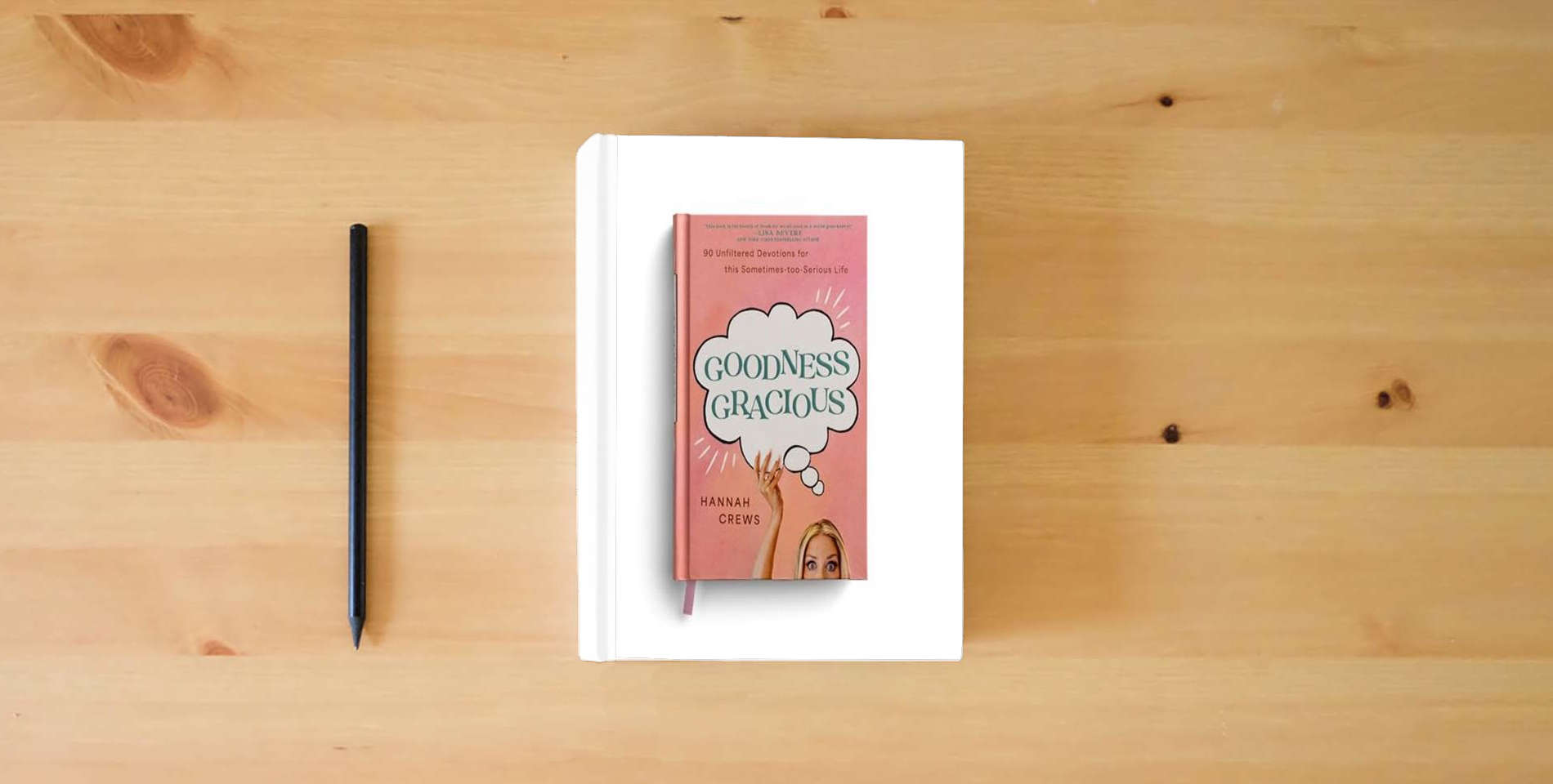 The book Goodness Gracious: 90 Unfiltered Devotions for This Sometimes-Too-Serious Life is on the table