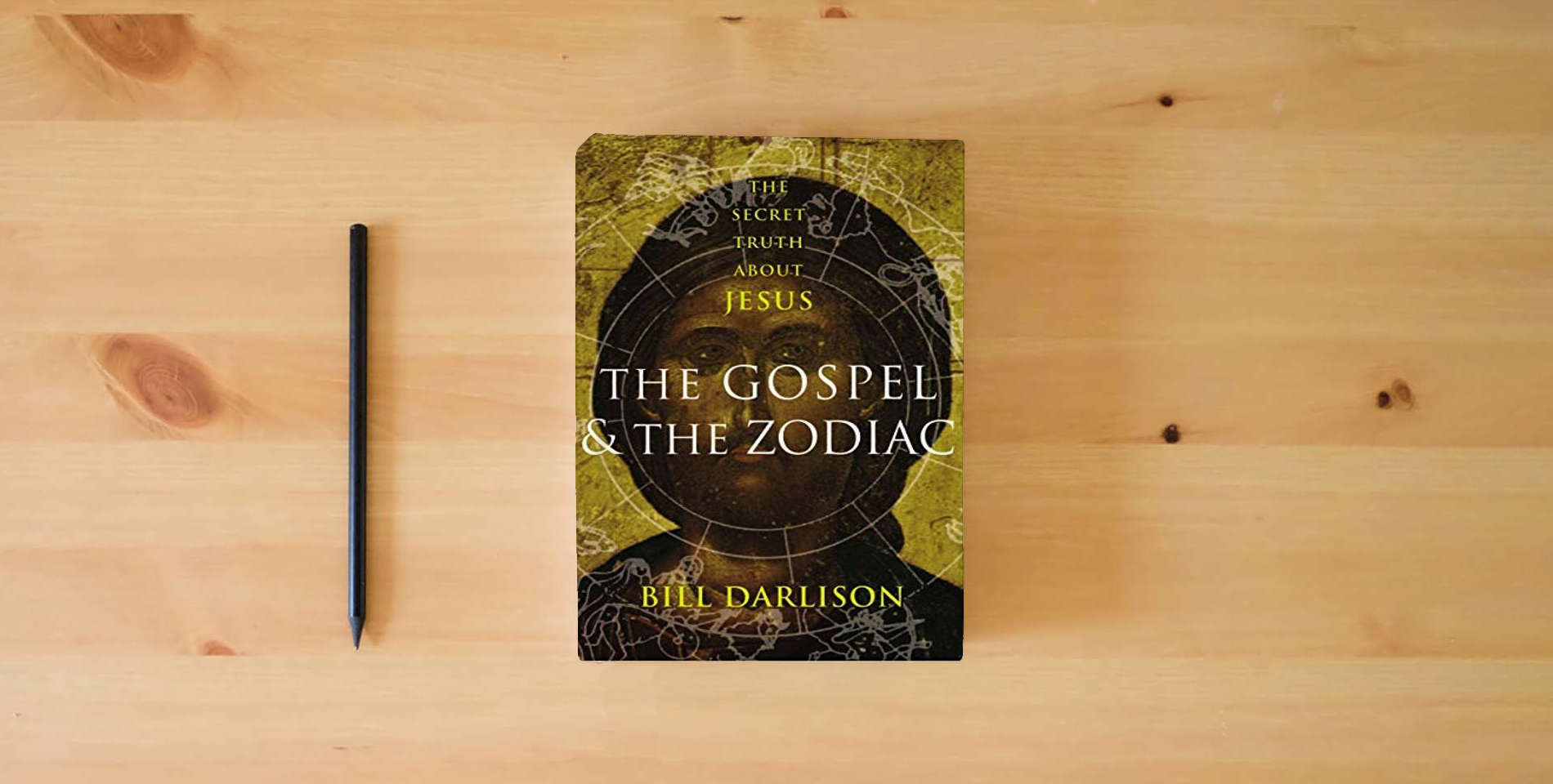 The book Gospel and the Zodiac: The Secret Truth about Jesus is on the table