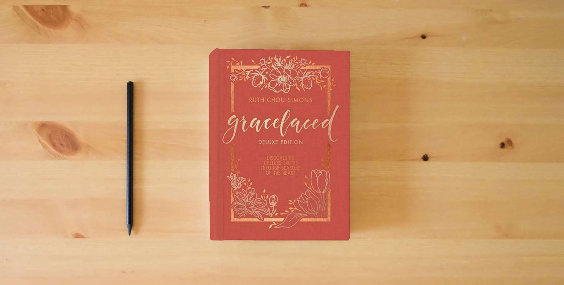 The book GraceLaced Deluxe Edition is on the table
