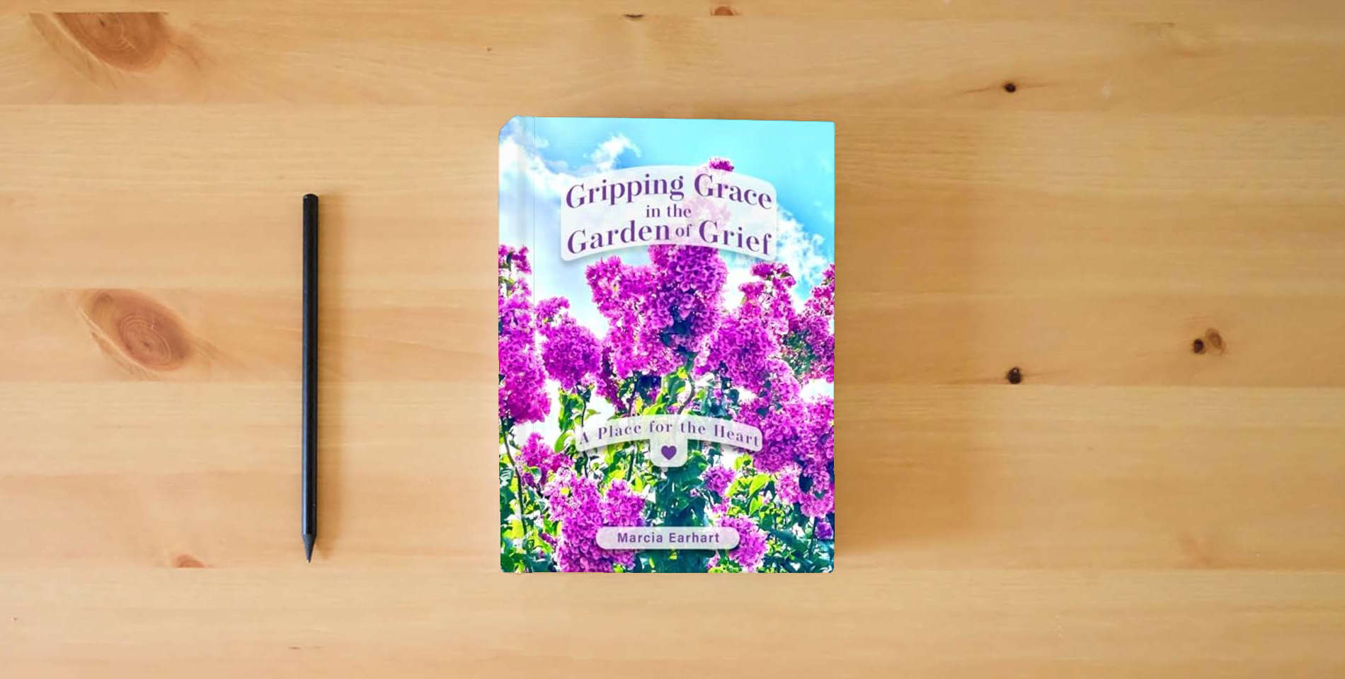 The book Gripping Grace in the Garden of Grief: A Place for the Heart is on the table