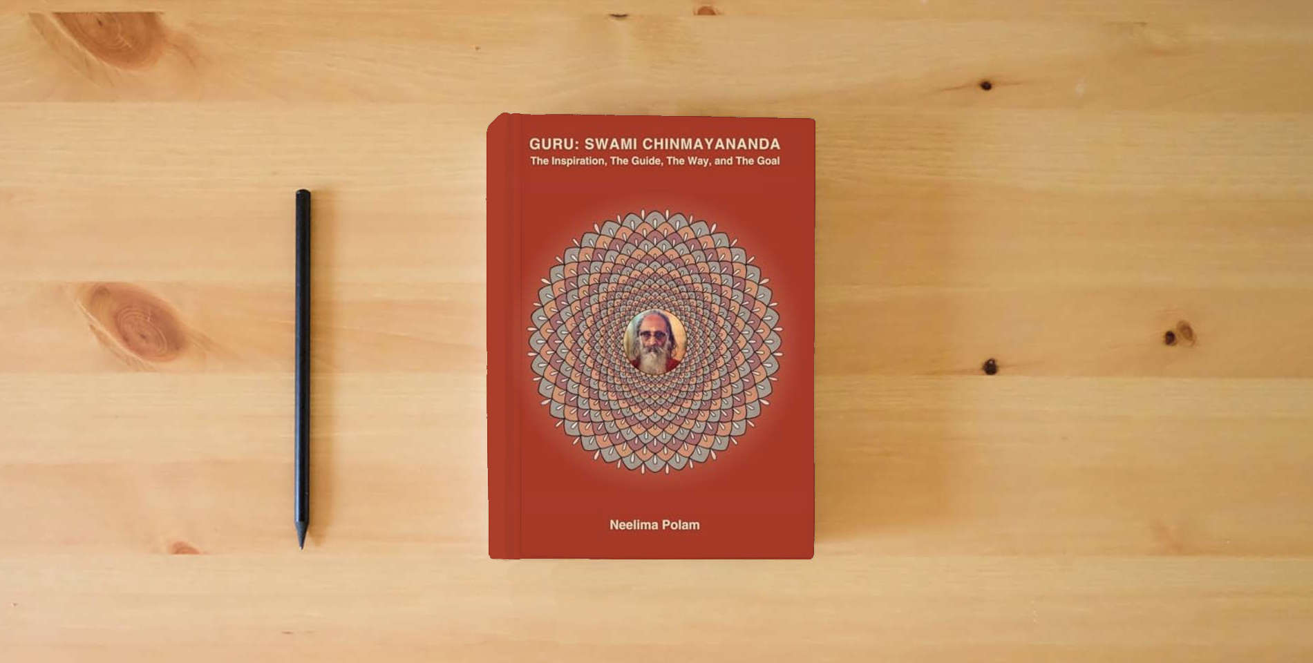 The book GURU: SWAMI CHINMAYANANDA: The Inspiration, The Guide, The Way, and The Goal (Reflections Along The Way) is on the table