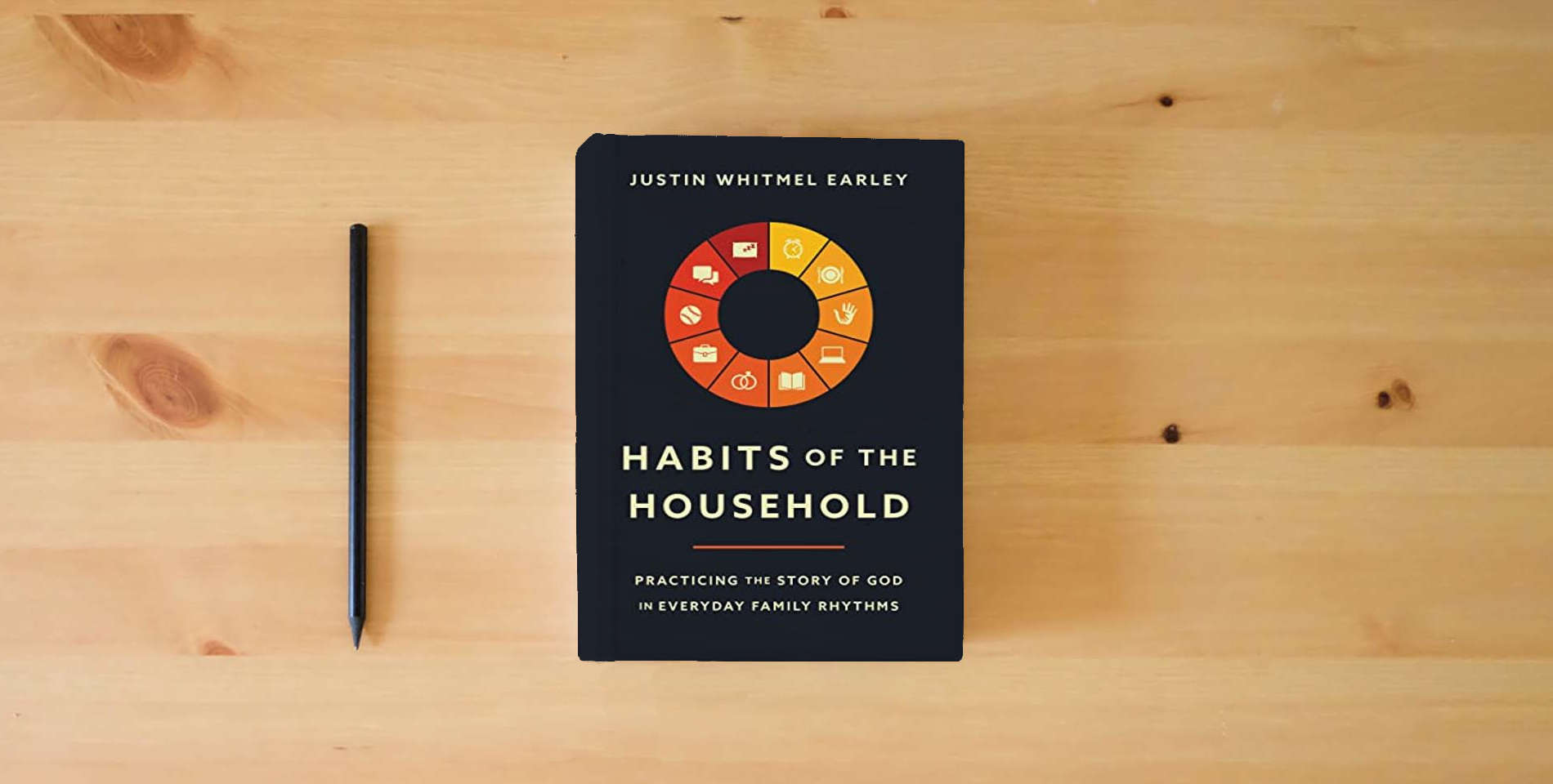 The book Habits of the Household: Practicing the Story of God in Everyday Family Rhythms is on the table