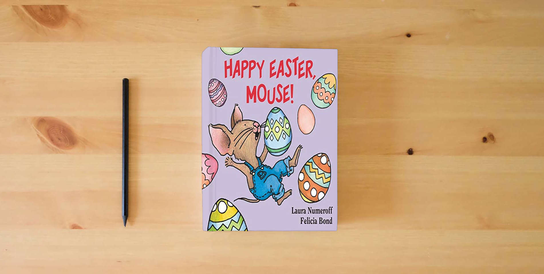 The book Happy Easter, Mouse! (If You Give...) is on the table