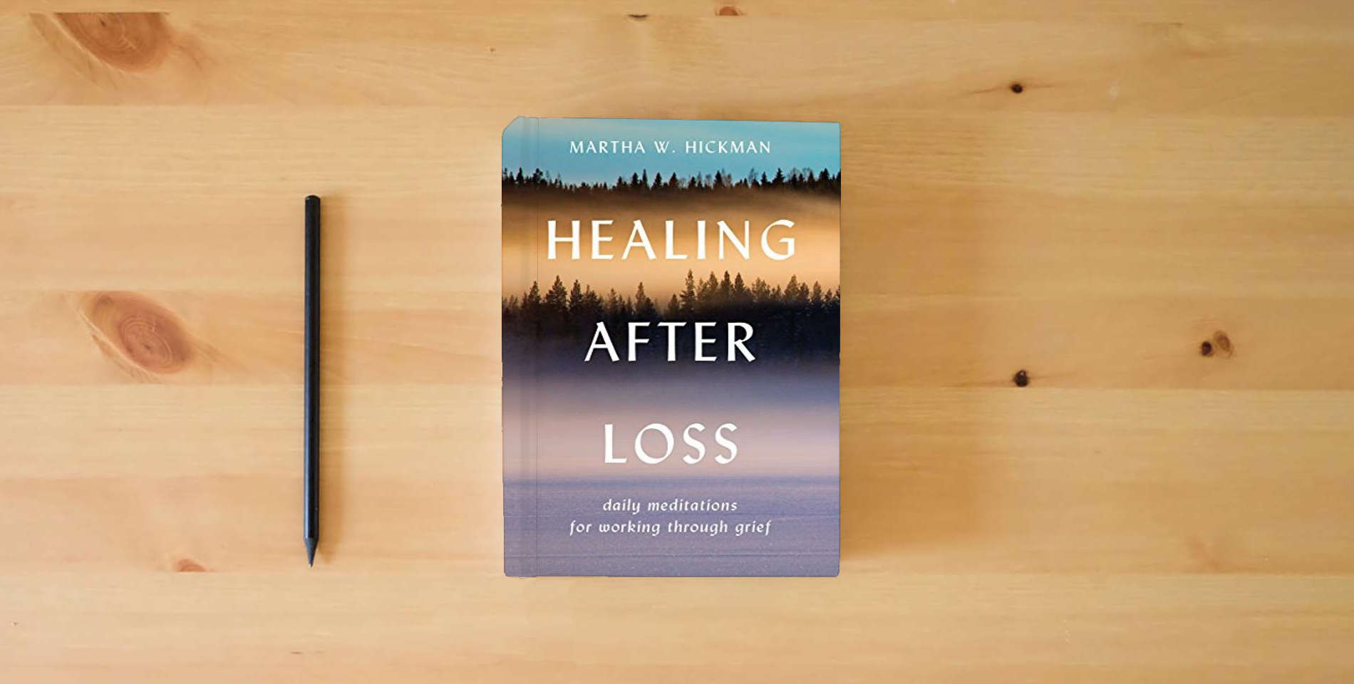 The book Healing After Loss: Daily Meditations For Working Through Grief is on the table