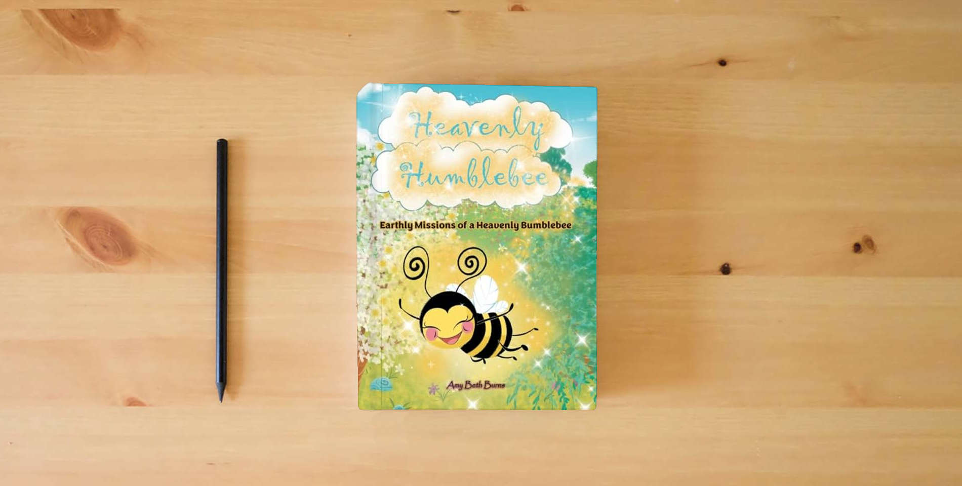 The book Heavenly Humblebee: Earthly Missions of Heavenly Bumblebee is on the table