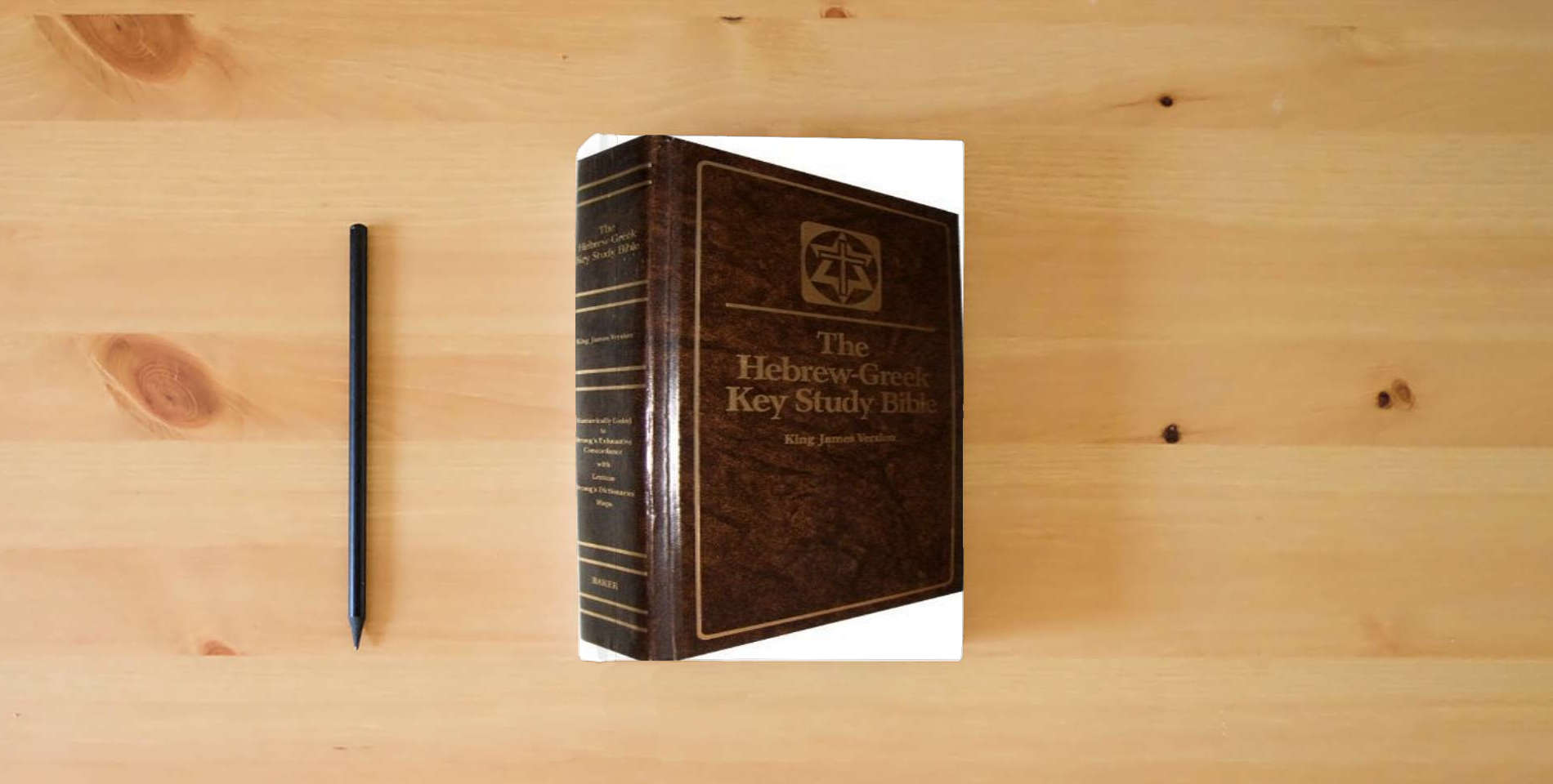The book Hebrew-Greek Key Study Bible is on the table