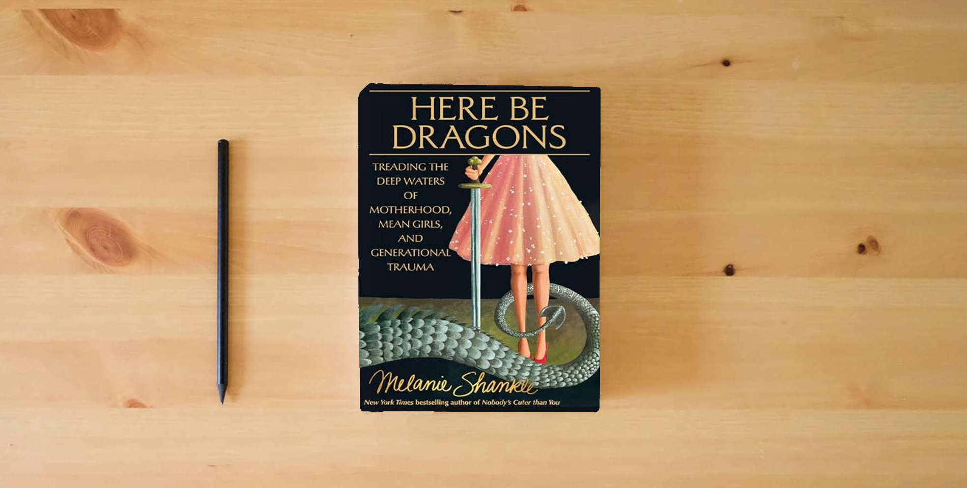 The book Here Be Dragons: Treading the Deep Waters of Motherhood, Mean Girls, and Generational Trauma is on the table