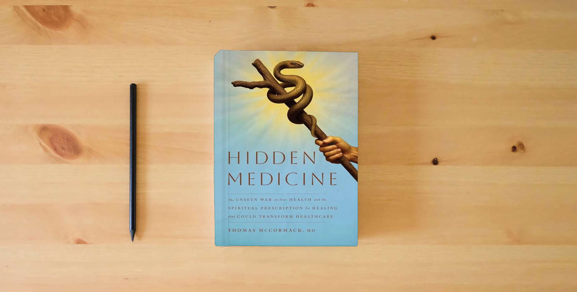 The book Hidden Medicine: The Unseen War on Your Health and the Spiritual Prescription for Healing That Could Transform Healthcare is on the table