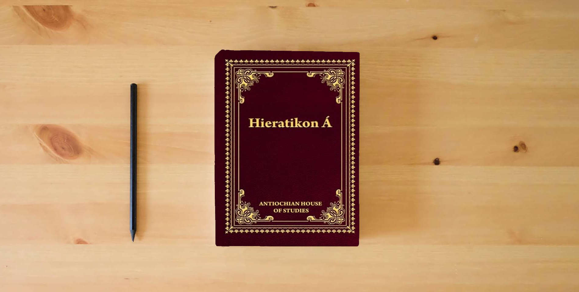 The book Hieratikon Á: The Divine Liturgy of St John Chrysostom with Complete Services and Appendices is on the table