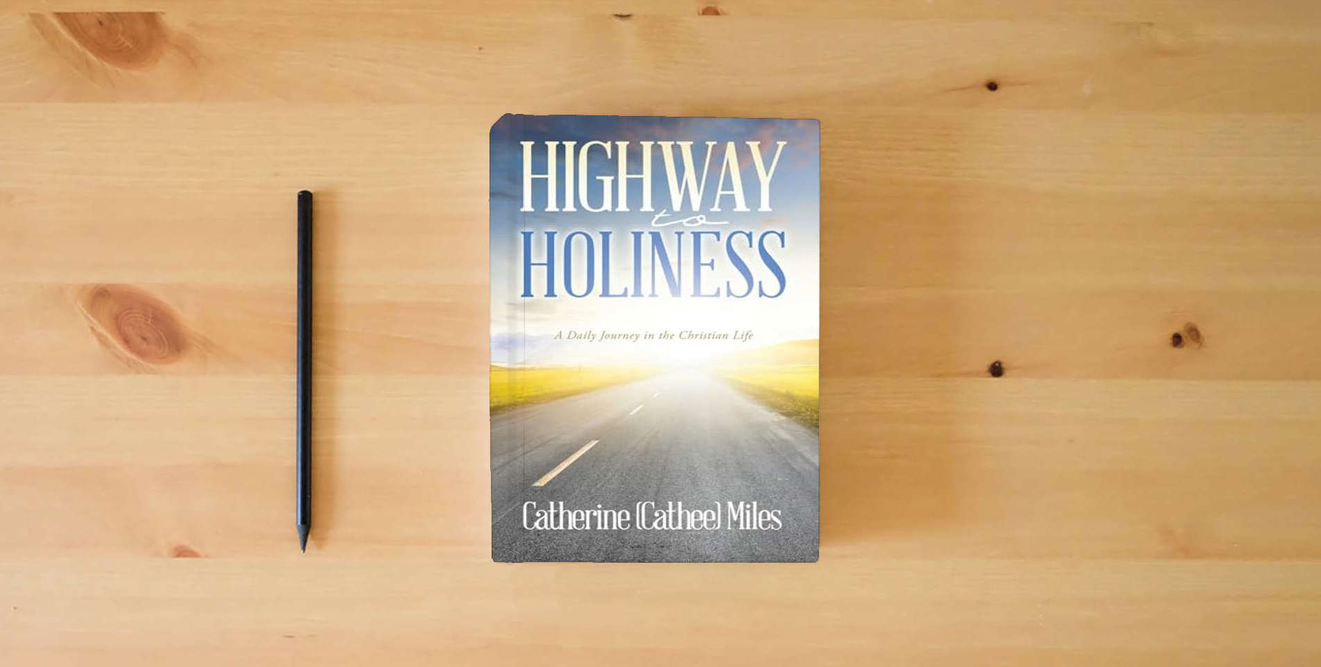 The book Highway to Holiness: A Daily Journey in the Christian Life is on the table