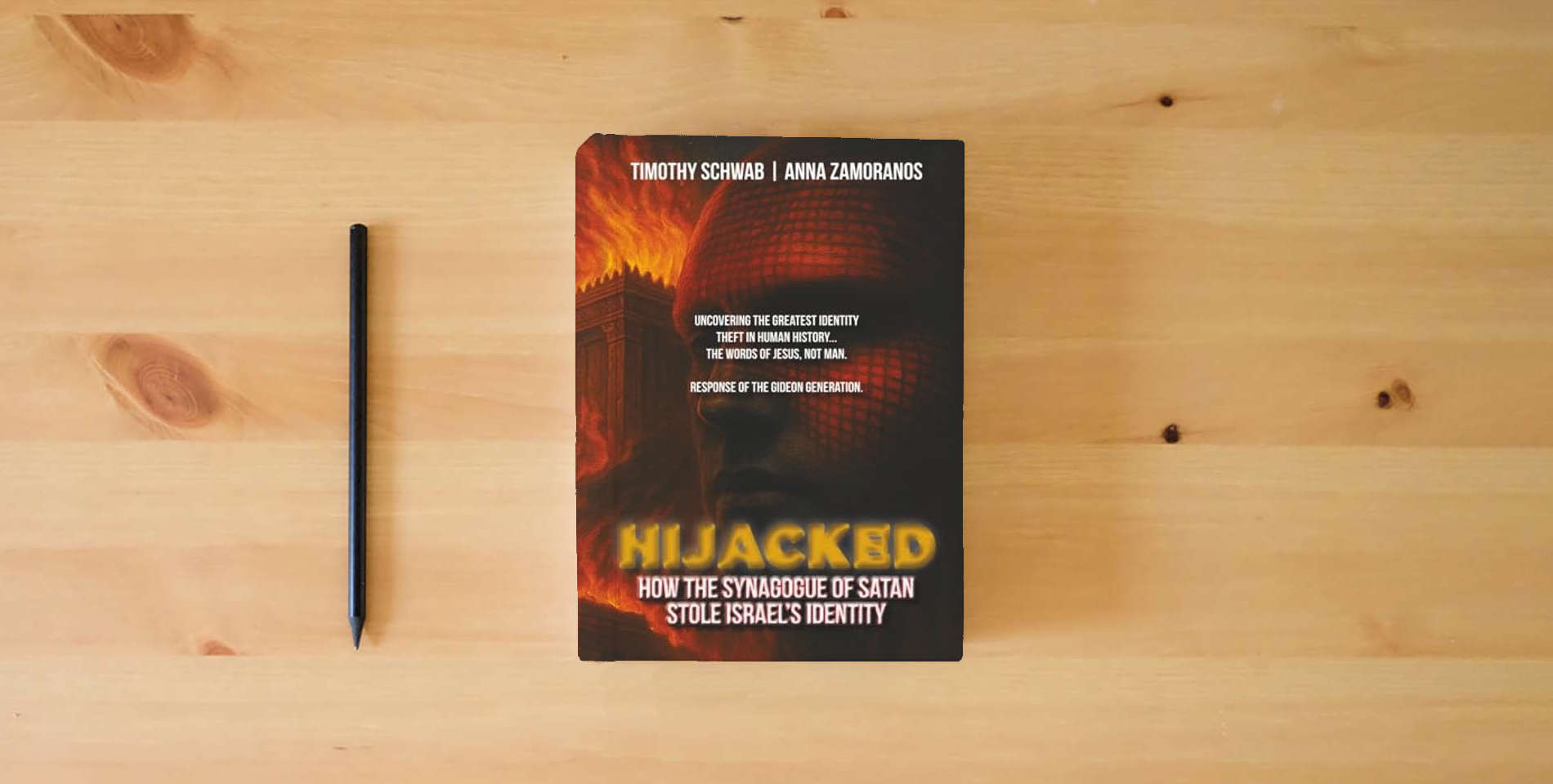 The book HIJACKED Color Version: How the Synagogue of Satan Stole Israel's Identity is on the table