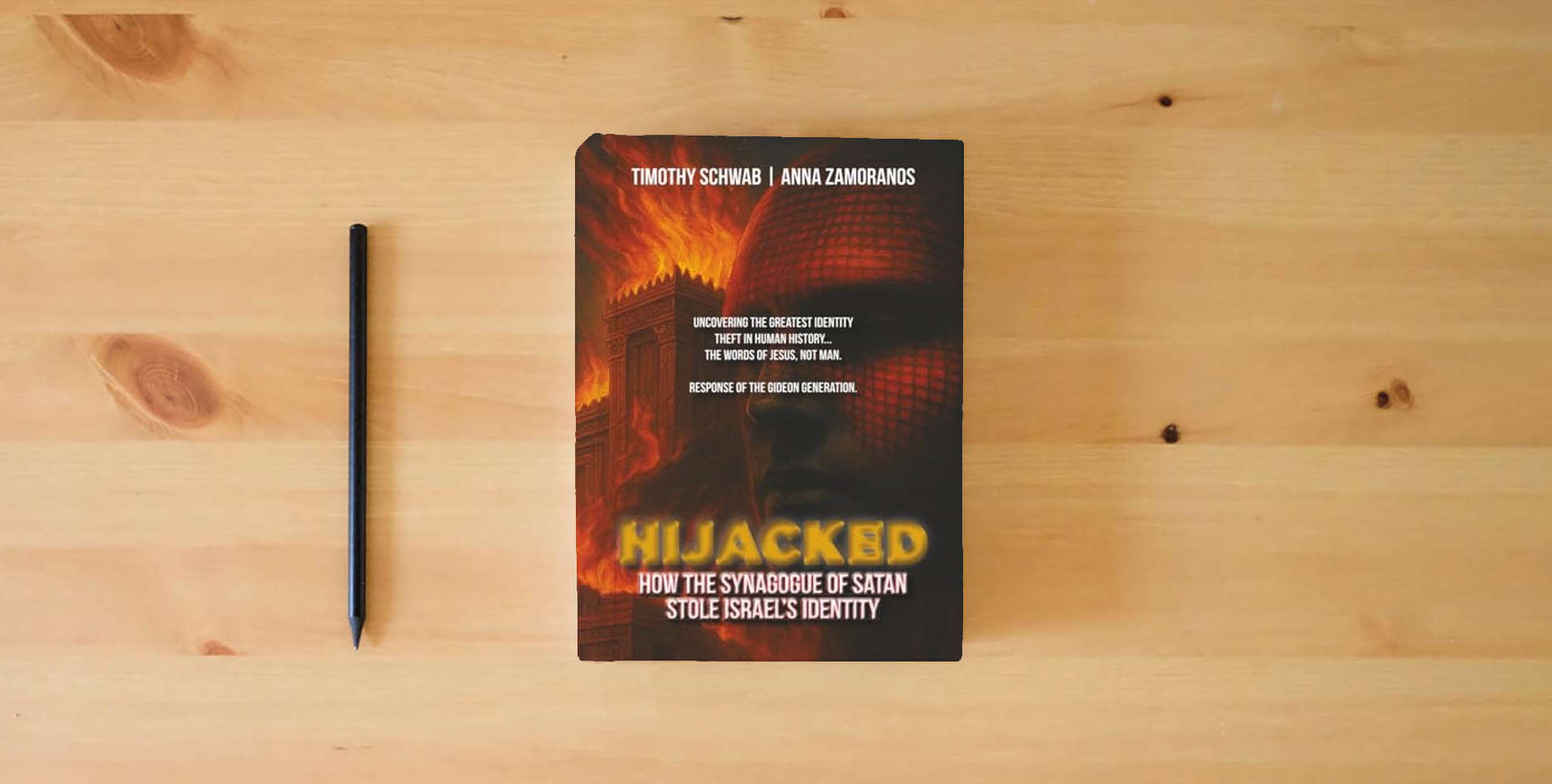 The book HIJACKED: How the Synagogue of Satan Stole Israel’s Identity is on the table
