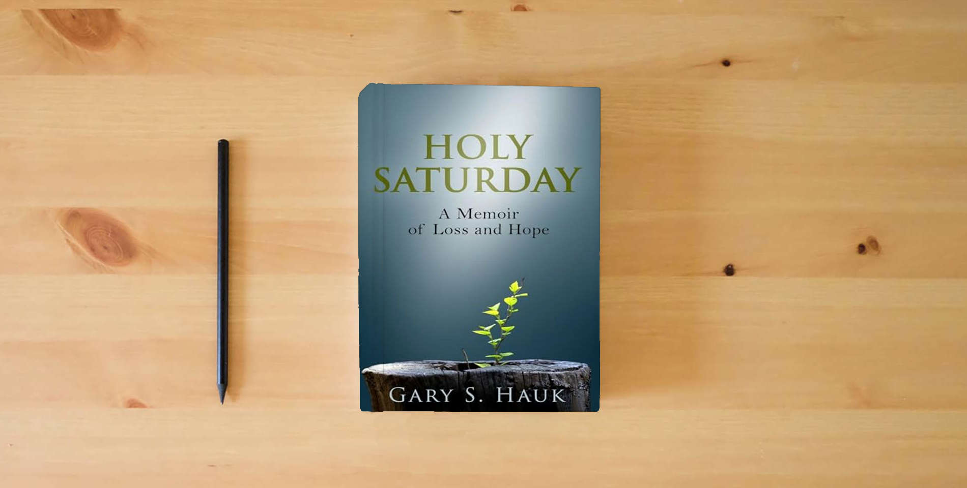 The book Holy Saturday : A Memoir of Loss and Hope is on the table