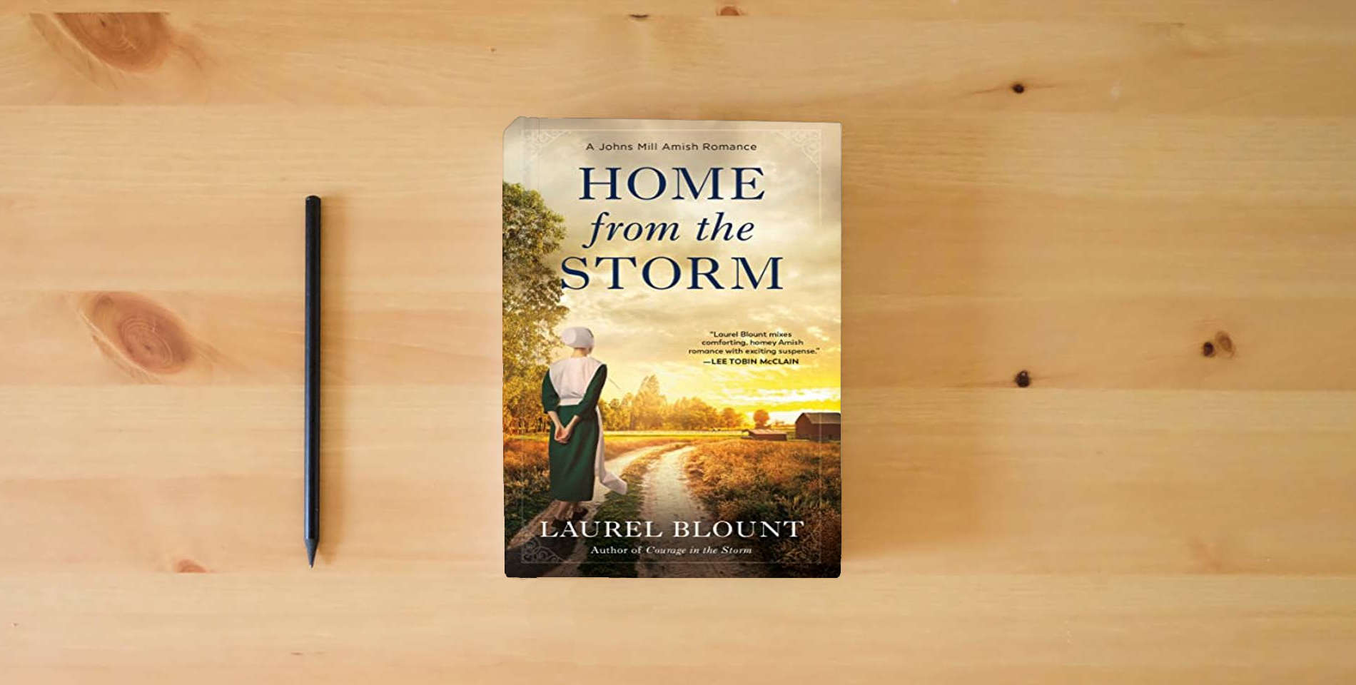 The book Home from the Storm (A Johns Mill Amish Romance) is on the table