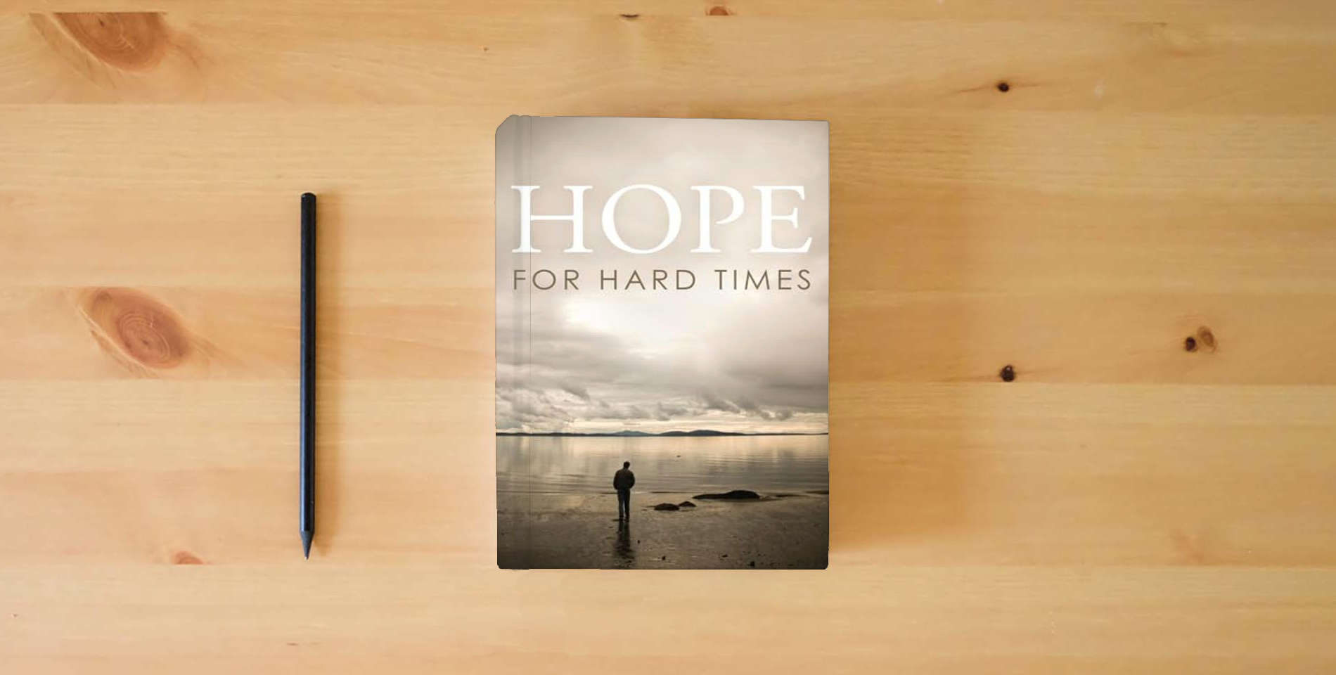 The book Hope for Hard Times (25-pack) (Proclaiming the Gospel) is on the table