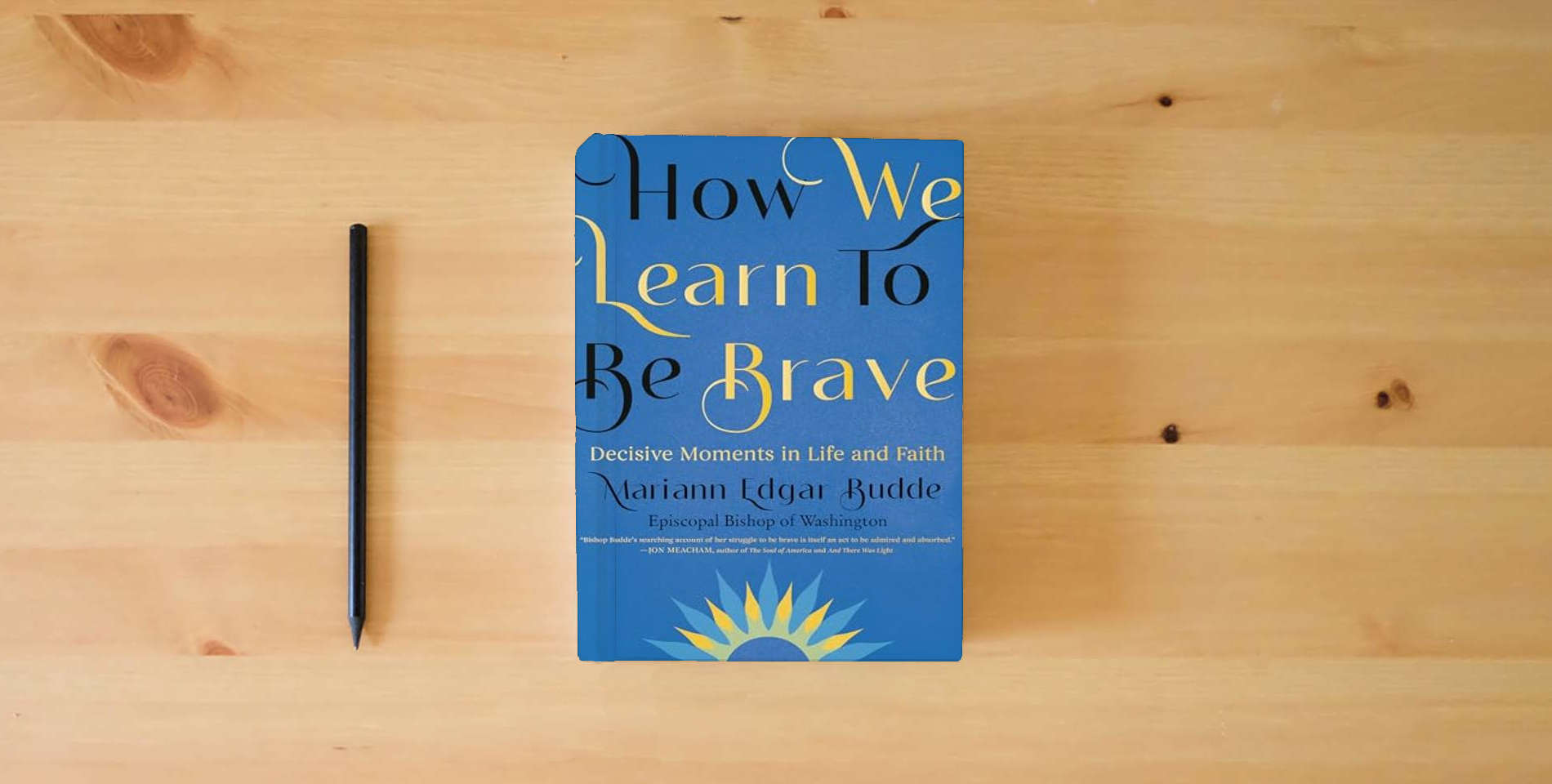 The book How We Learn to Be Brave: Decisive Moments in Life and Faith is on the table