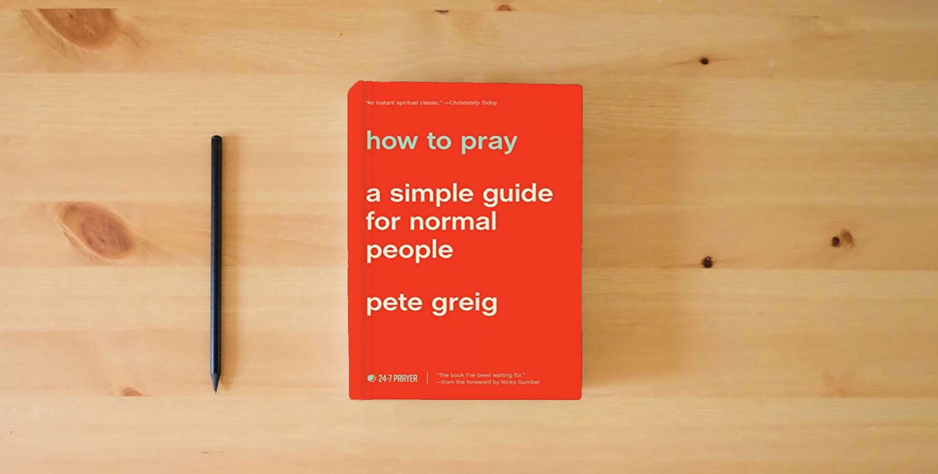 The book How to Pray: A Simple Guide for Normal People is on the table