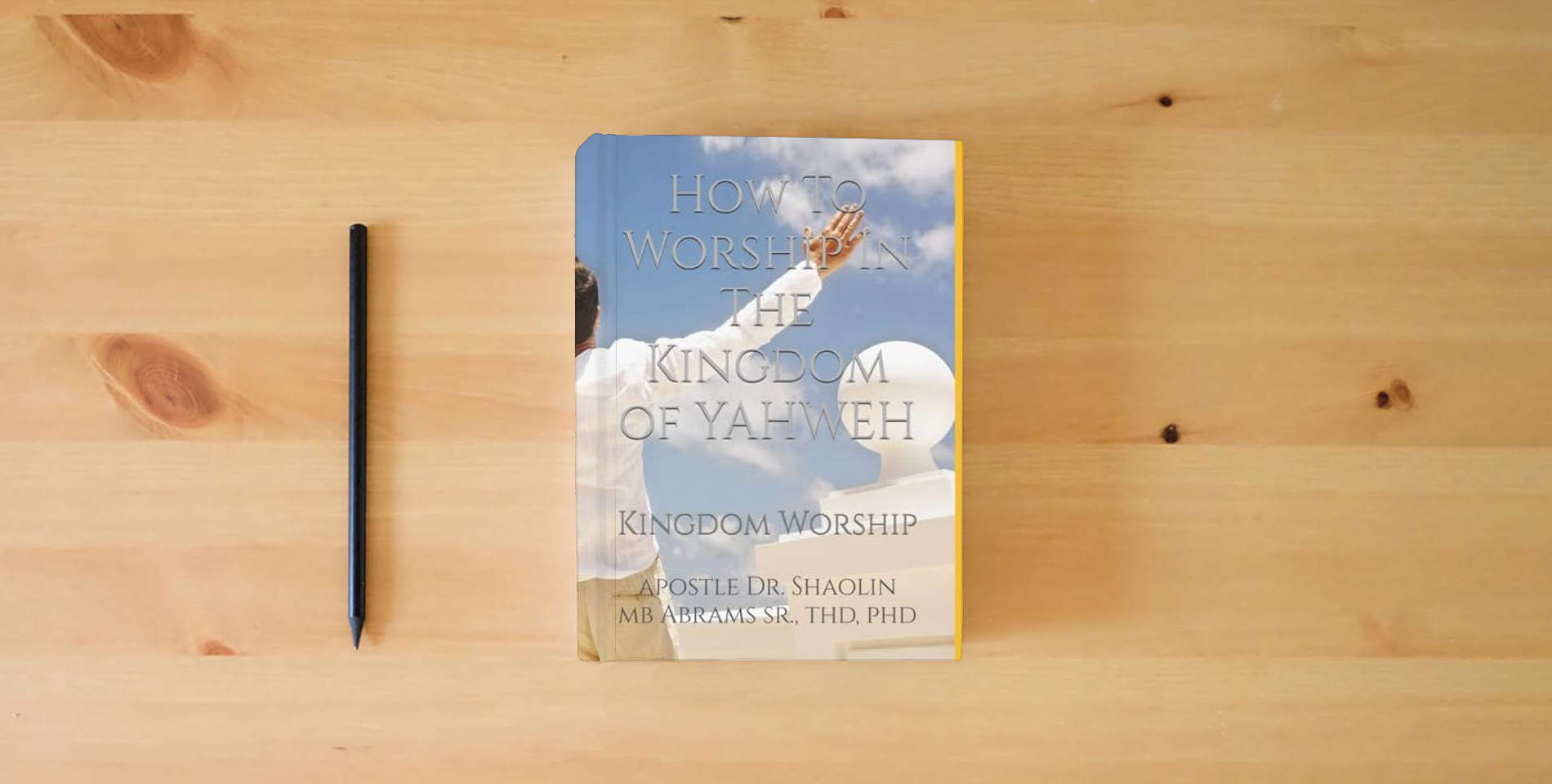 The book How To Worship In The Kingdom of YAHWEH: Kingdom Worship is on the table