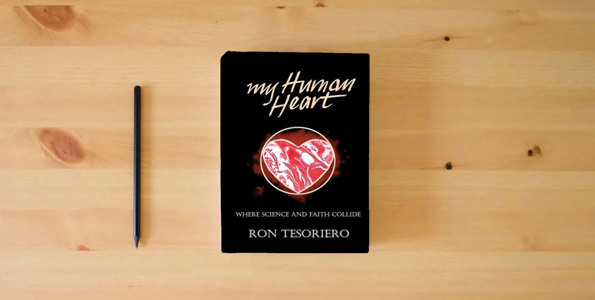 The book My Human Heart: Where Science and Faith Collide is on the table