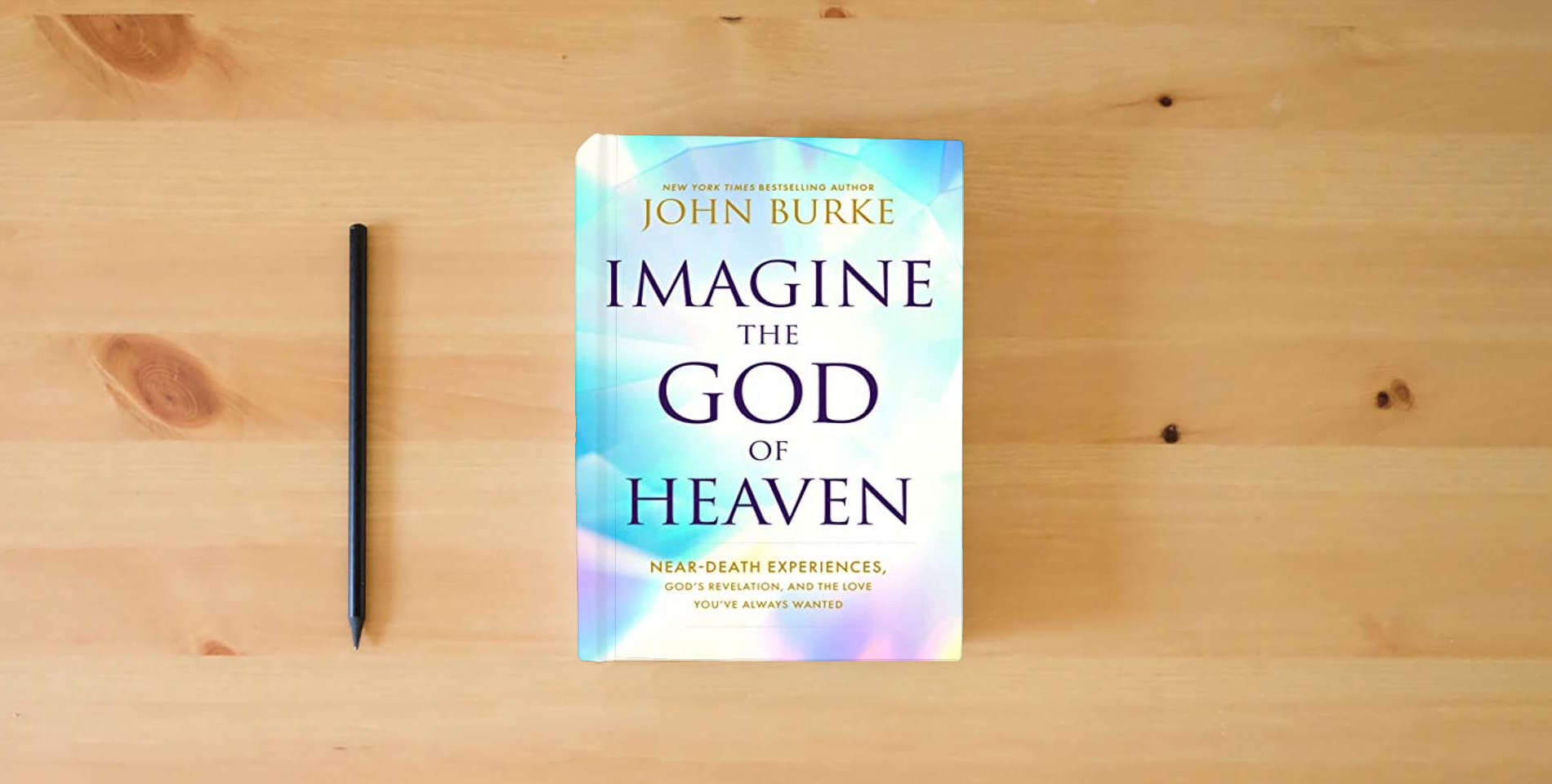 The book Imagine the God of Heaven: Near-Death Experiences, God’s Revelation, and the Love You’ve Always Wanted is on the table