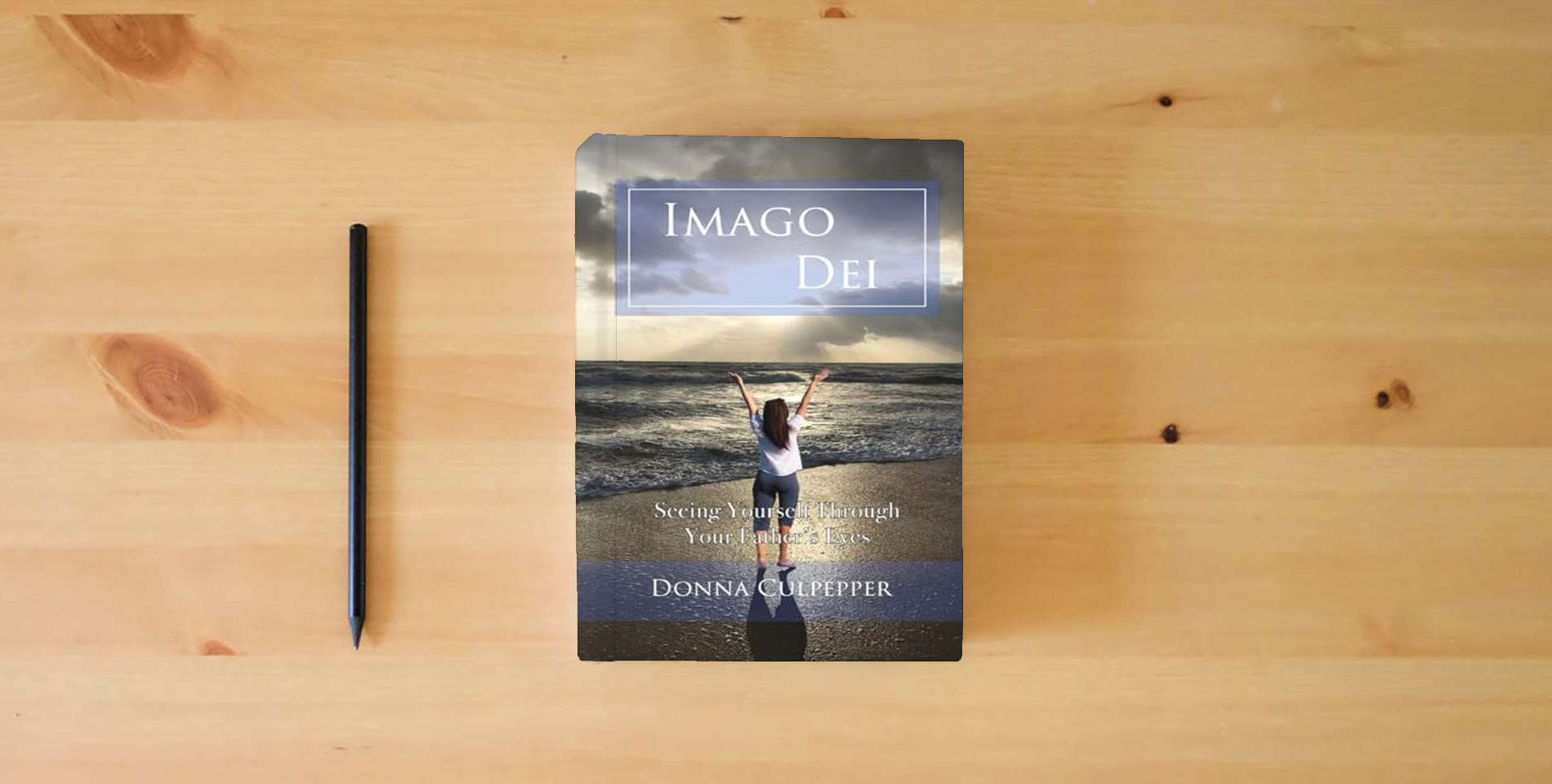 The book Imago Dei: Seeing Yourself Through Your Father's Eyes is on the table