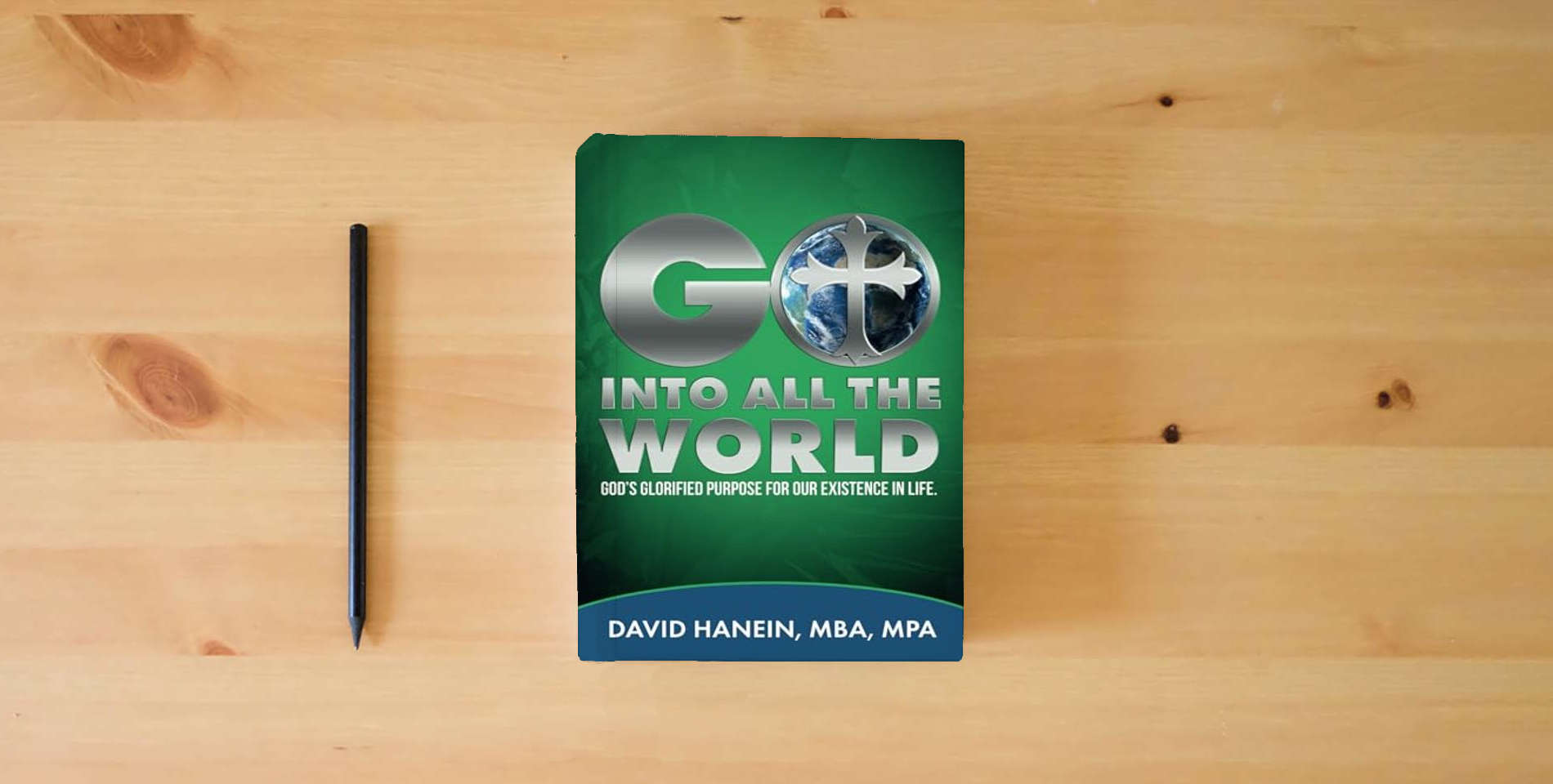 The book GO INTO ALL THE WORLD: GOD'S GLORIFIED PUROSE FOR OUR EXISTANCE IN LIFE is on the table