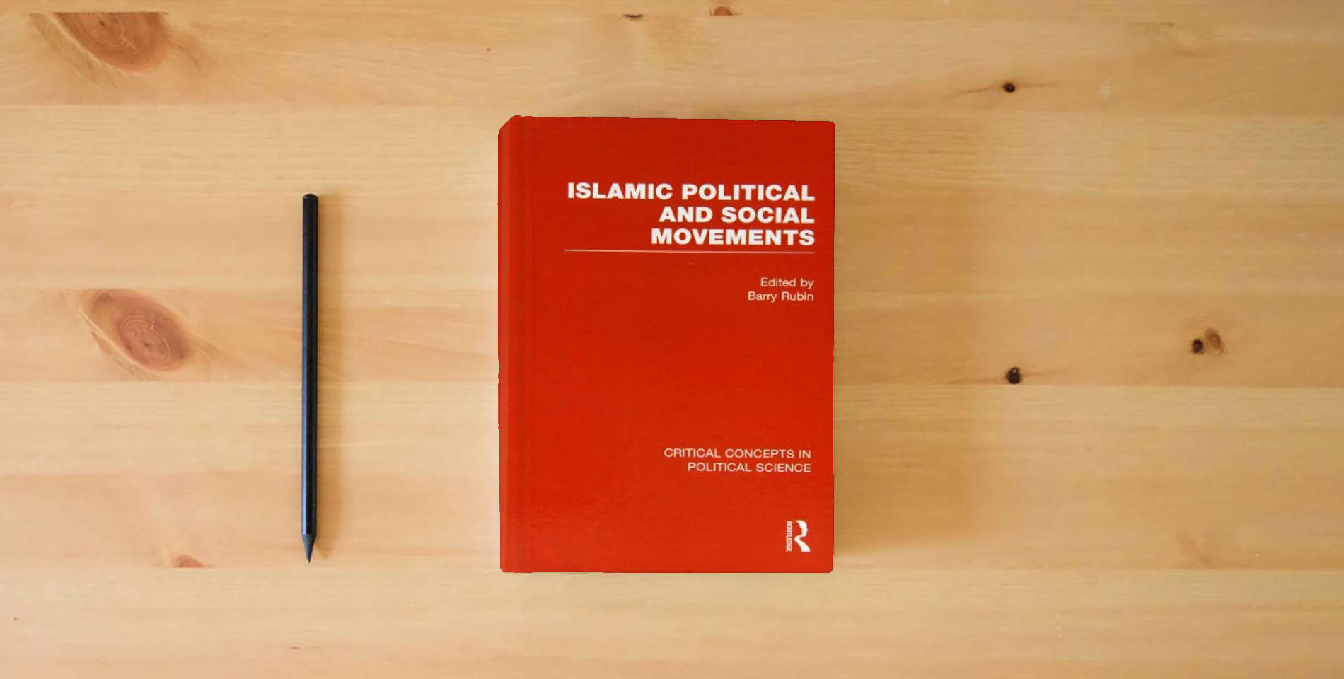 The book Islamic Political and Social Movements (Critical Concepts in Political Science) is on the table