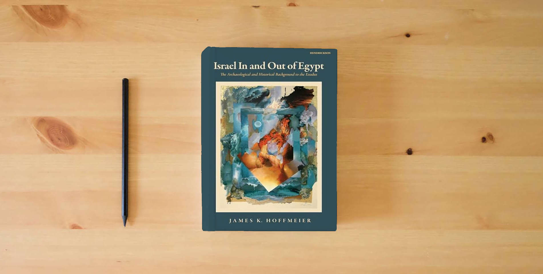 The book Israel In and Out of Egypt: The Archaeological and Historical Background to the Exodus is on the table