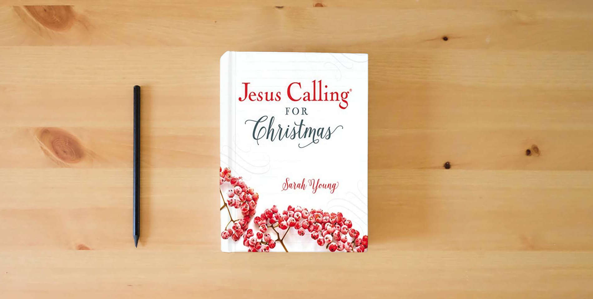 The book Jesus Calling for Christmas, Padded Hardcover, with Full Scriptures is on the table