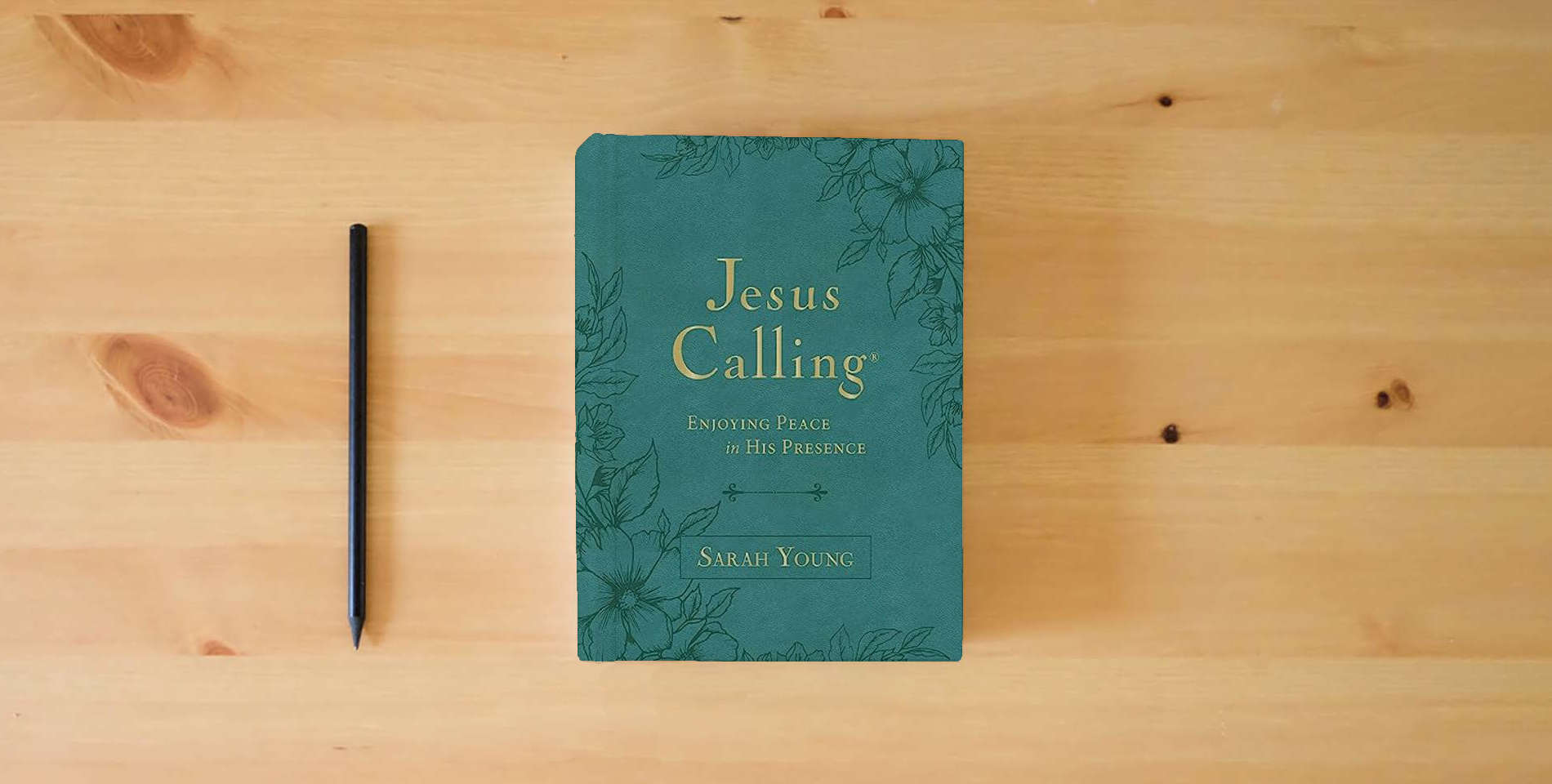 The book Jesus Calling, Large Text Teal Leathersoft, with Full Scriptures: Enjoying Peace in His Presence (A 365-Day Devotional) is on the table