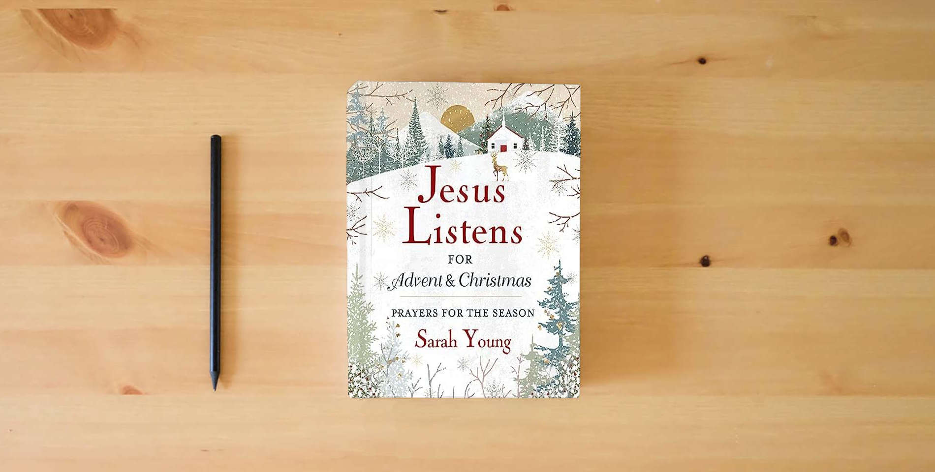 The book Jesus Listens--for Advent and Christmas, Padded Hardcover, with Full Scriptures: Prayers for the Season is on the table