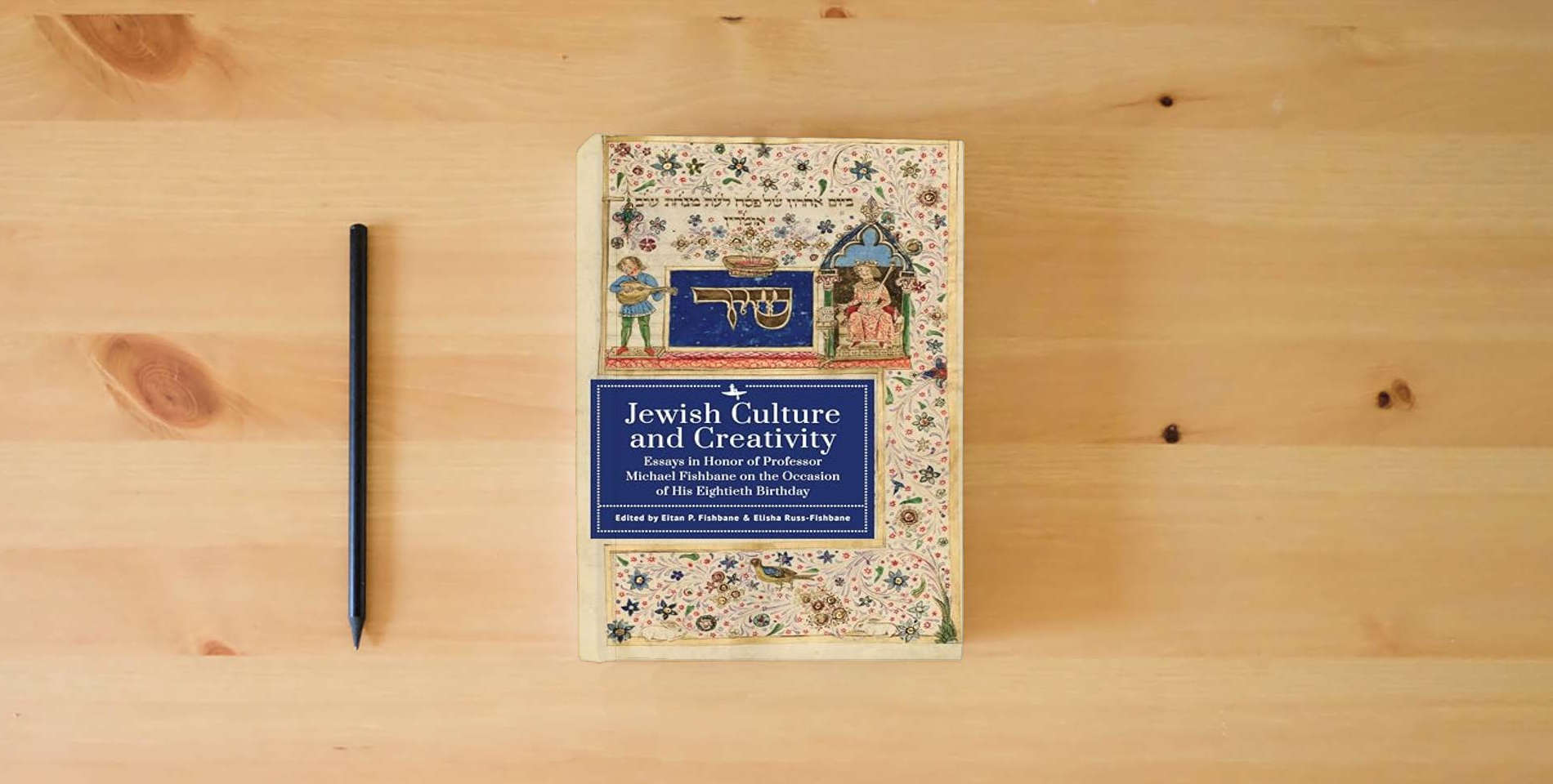 The book Jewish Culture and Creativity: Essays in Honor of Professor Michael Fishbane on the Occasion of His Eightieth Birthday is on the table