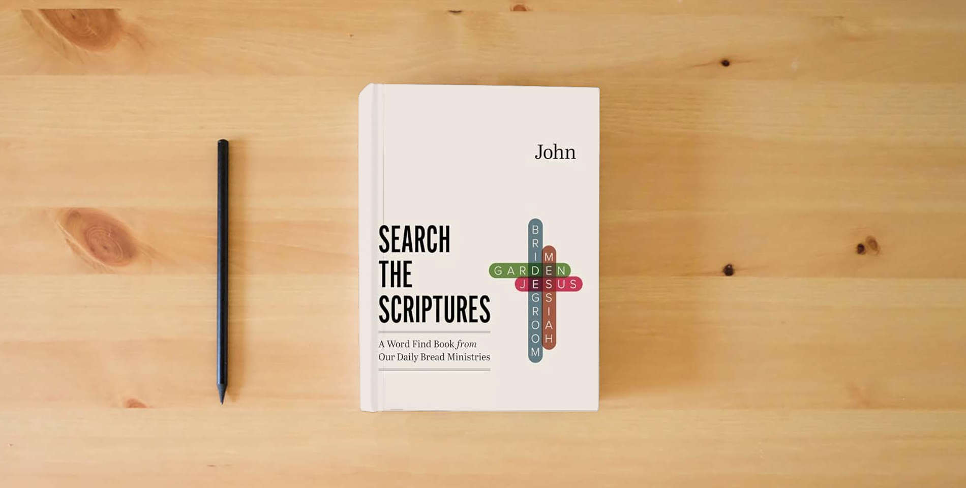 The book John: A Word Find Book from Our Daily Bread Ministries (Search the Scriptures) is on the table