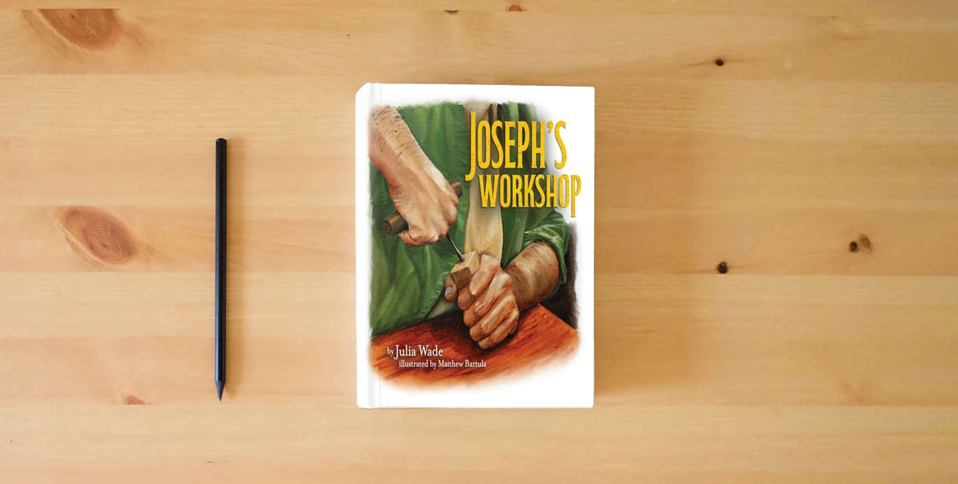 The book Joseph's Workshop is on the table