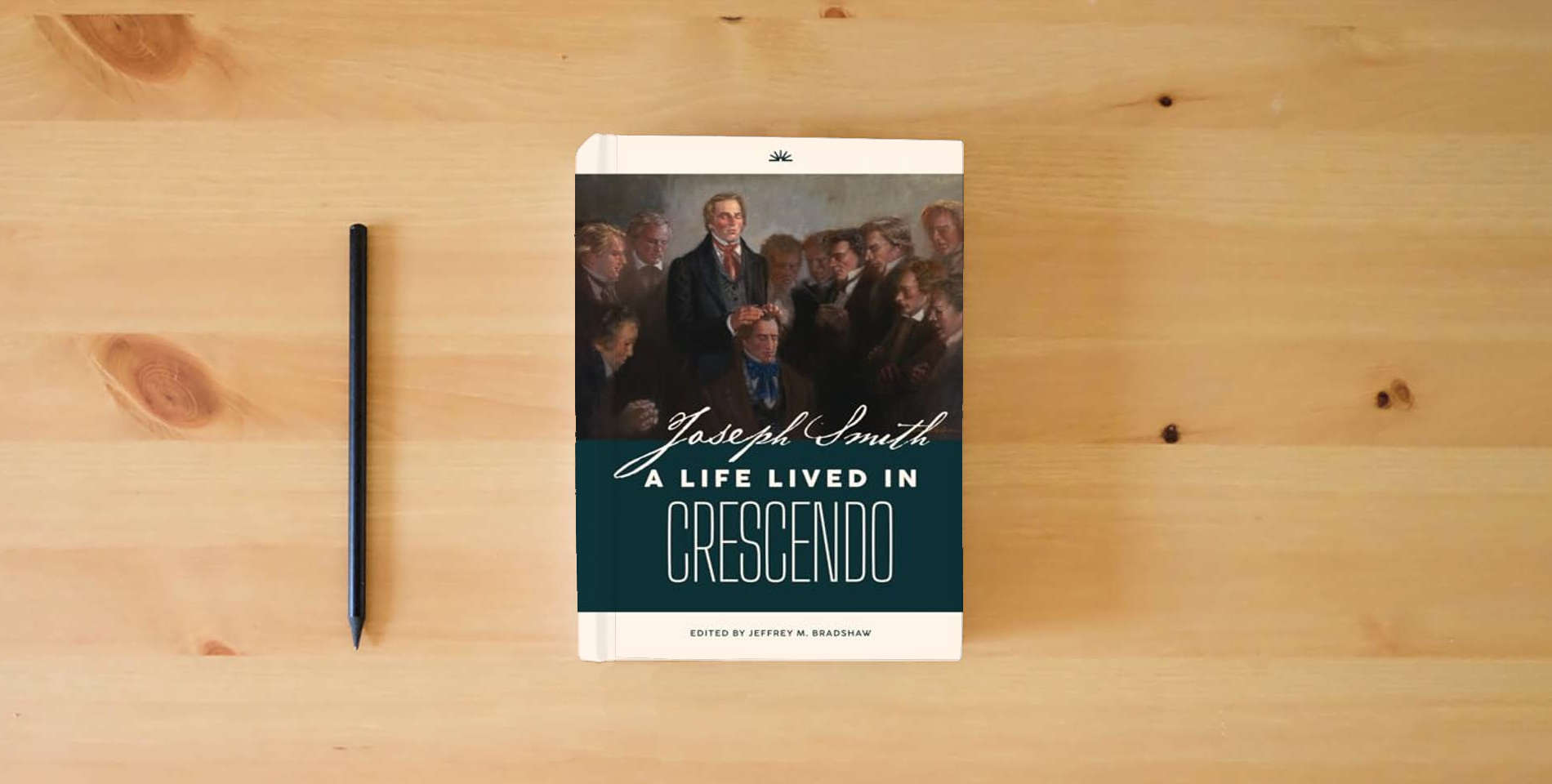 The book Joseph Smith: A Life Lived in Crescendo (Volume 1, Color, Hardback) (Joseph Smith: A Life Lived in Crescendo (Two Volumes)) is on the table